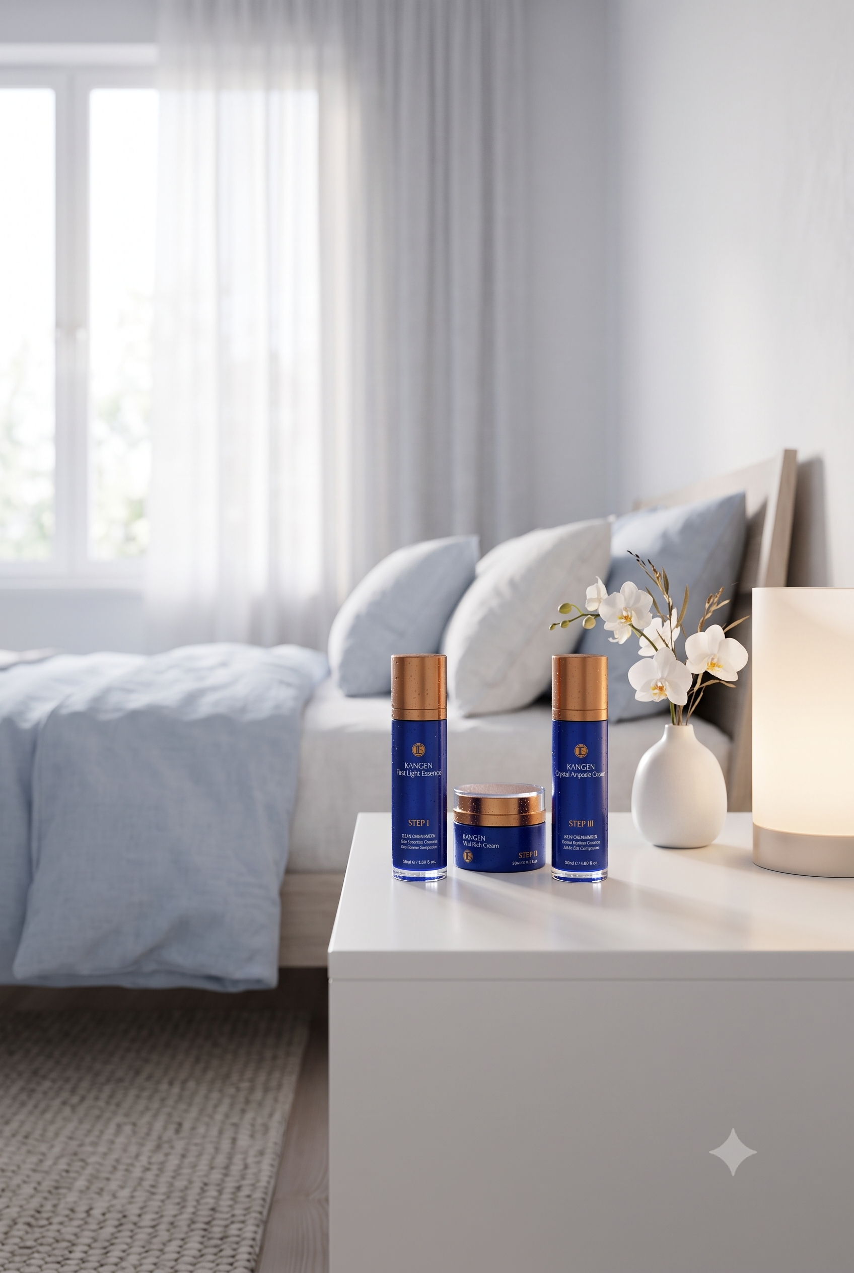 Kangen Beaute luxury 3-step anti-aging skincare collection by Enagic displayed on a modern white bedside table in a serene, light blue bedroom setting.