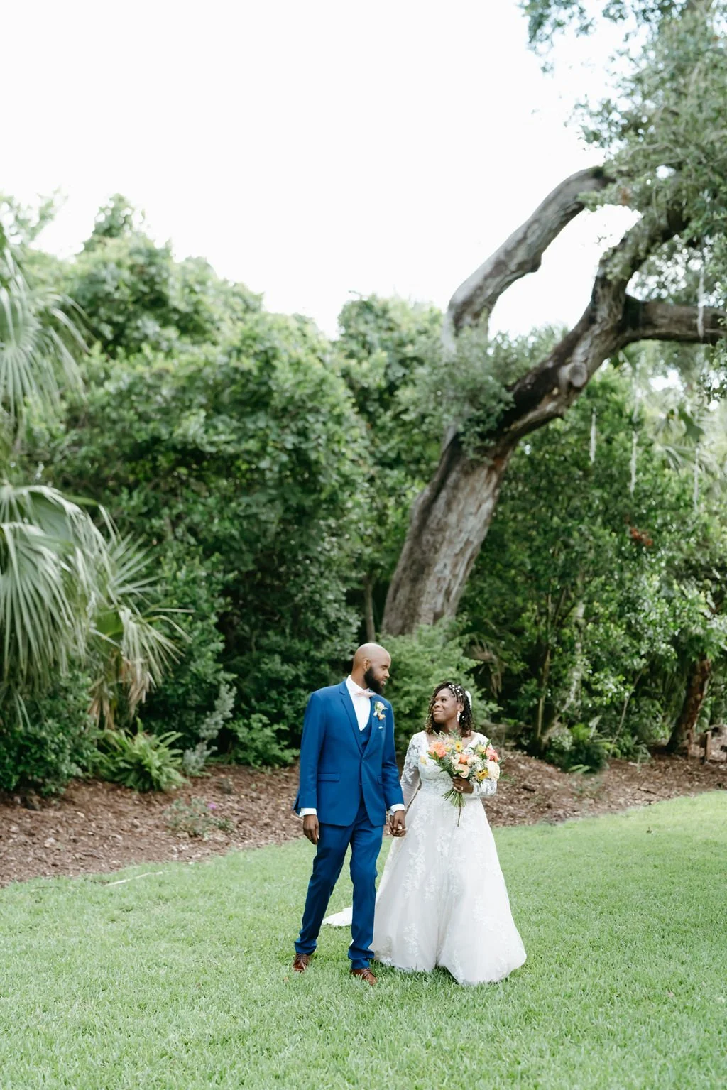 bride and groom holding hands