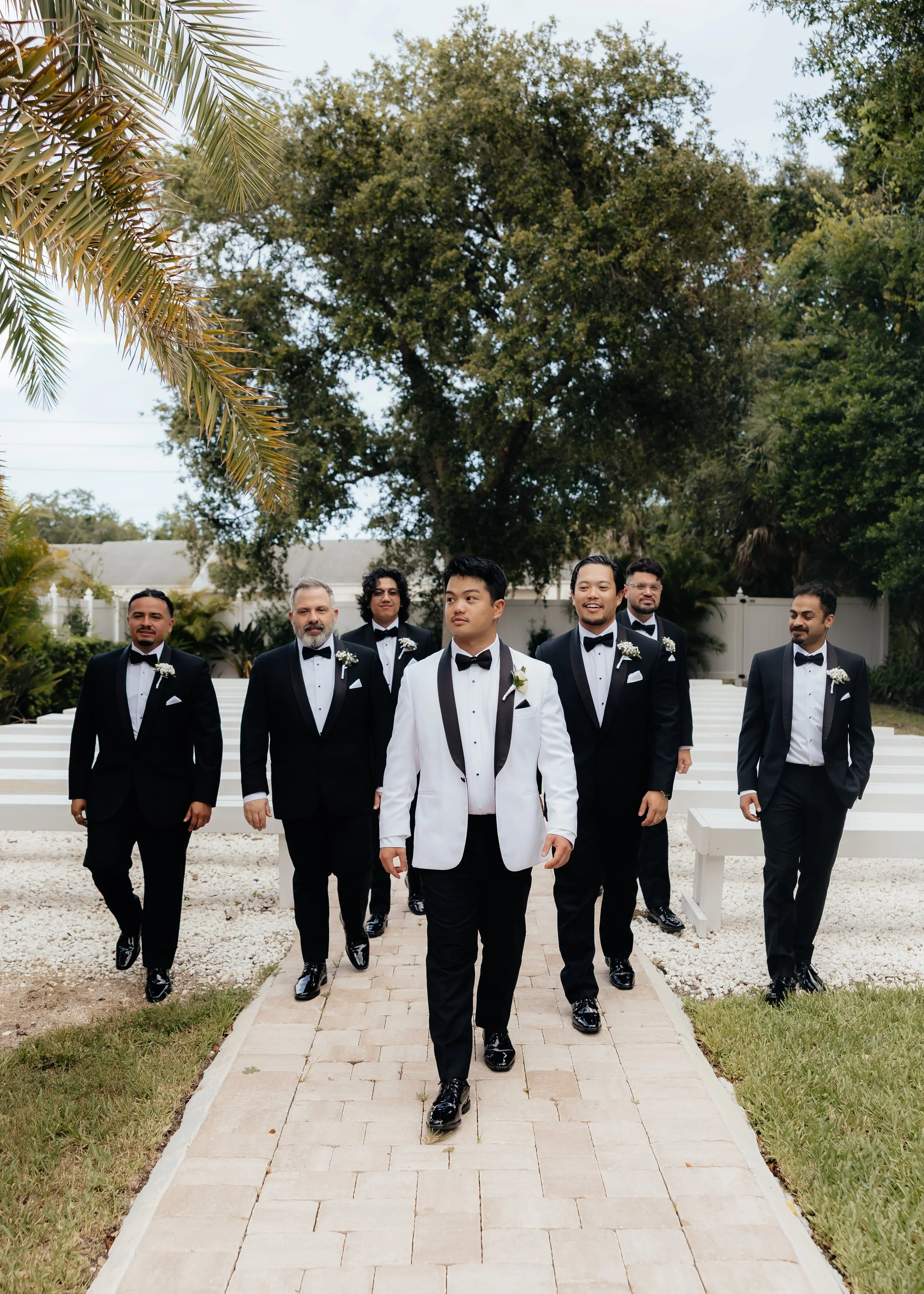 groom walking with groomsmen