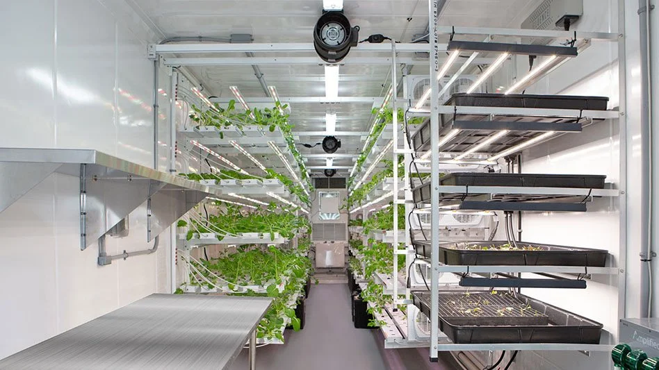 a clean Indoor farm laboratory with bright lighting, neat tubing, and and fans