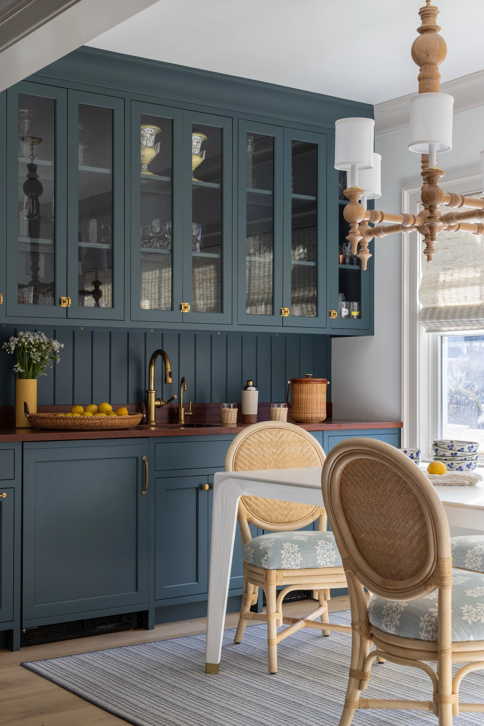 china cabinet with rattan chairs by Raquel Langworthy