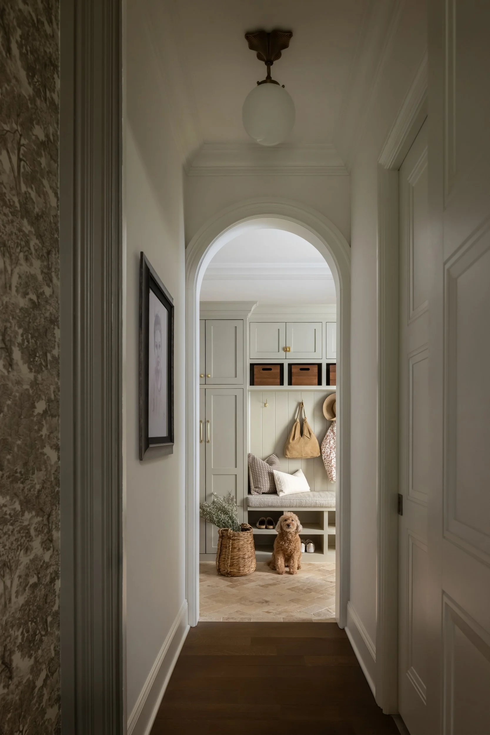 Arched corridor with built-in shelving by Raquel Langworthy