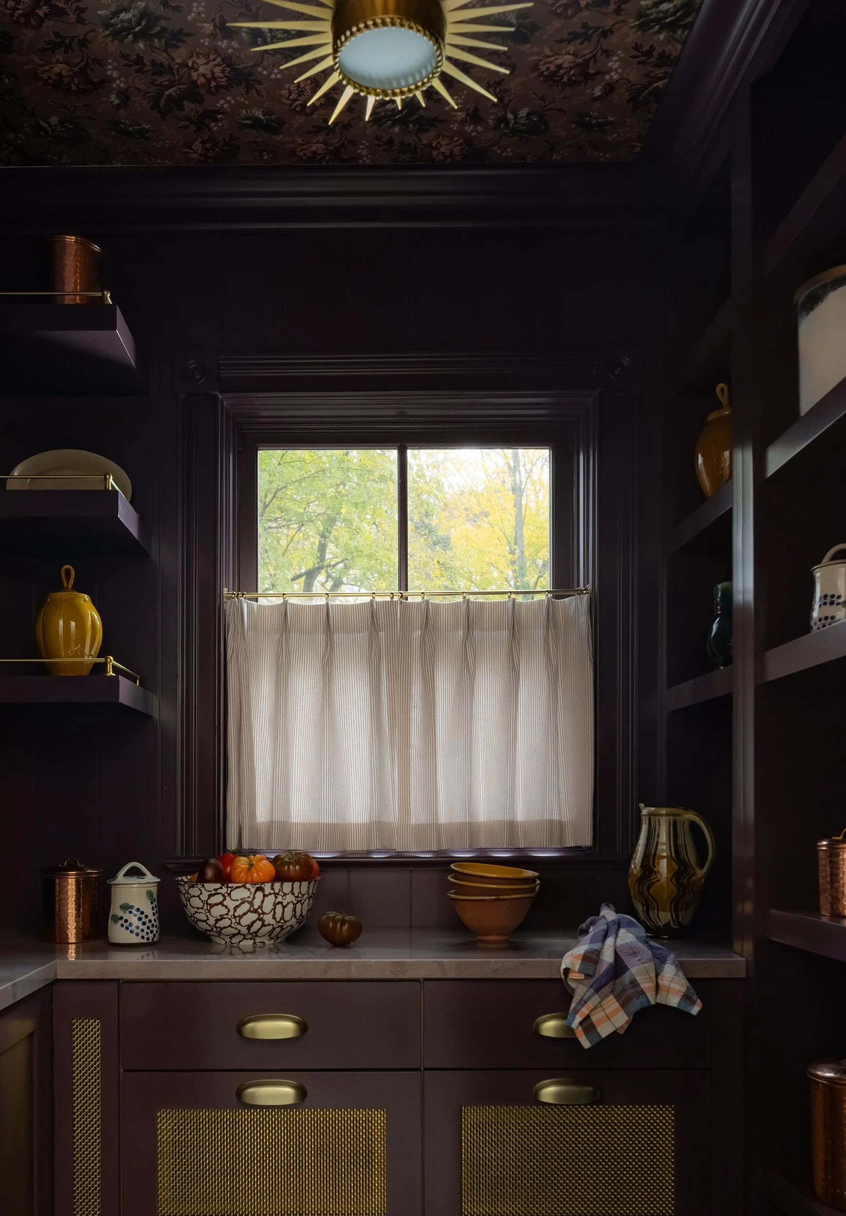 Moody dark butler's pantry with brass hardware by Raquel Langworthy