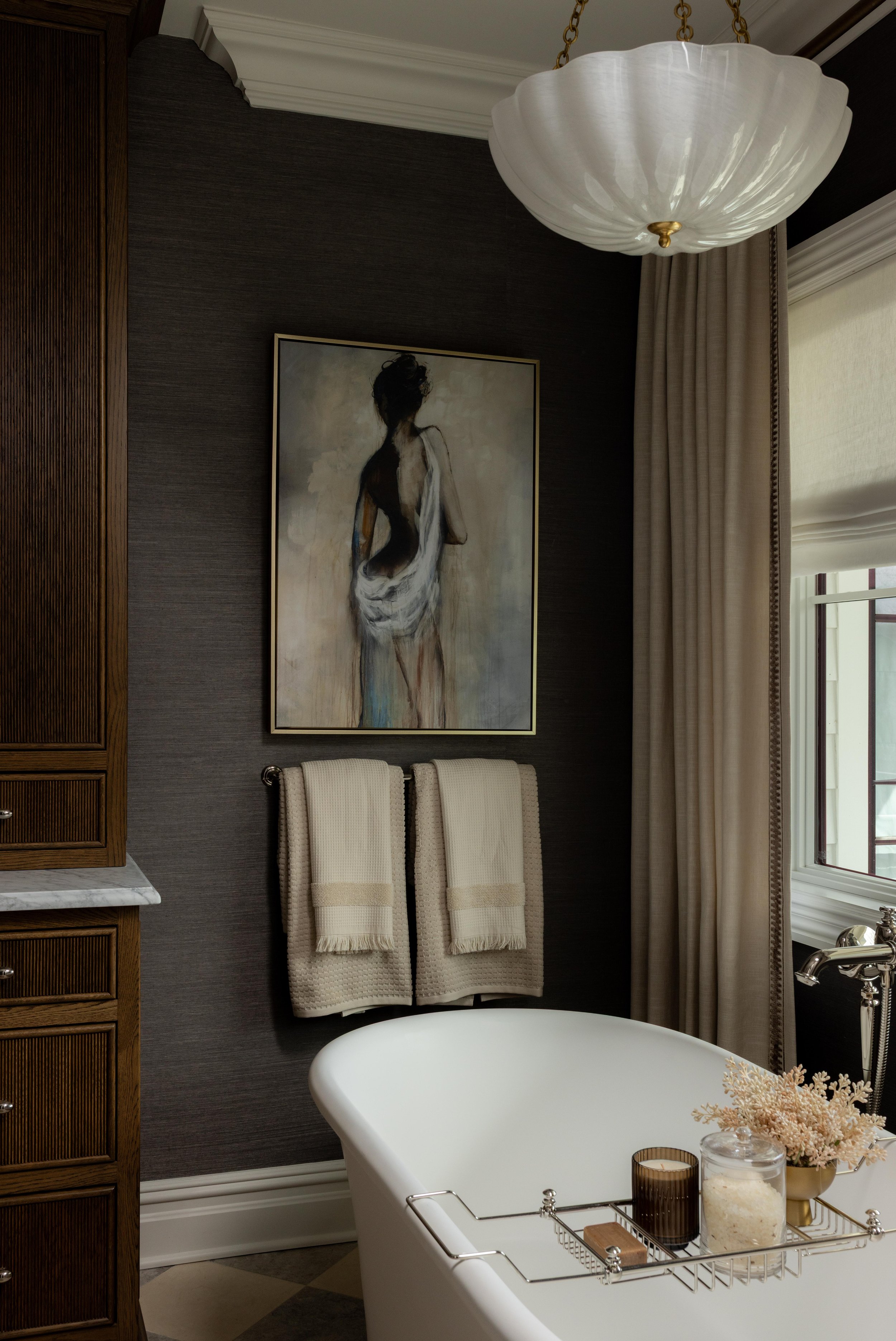 Moody bathroom with freestanding white tub by Raquel Langworthy