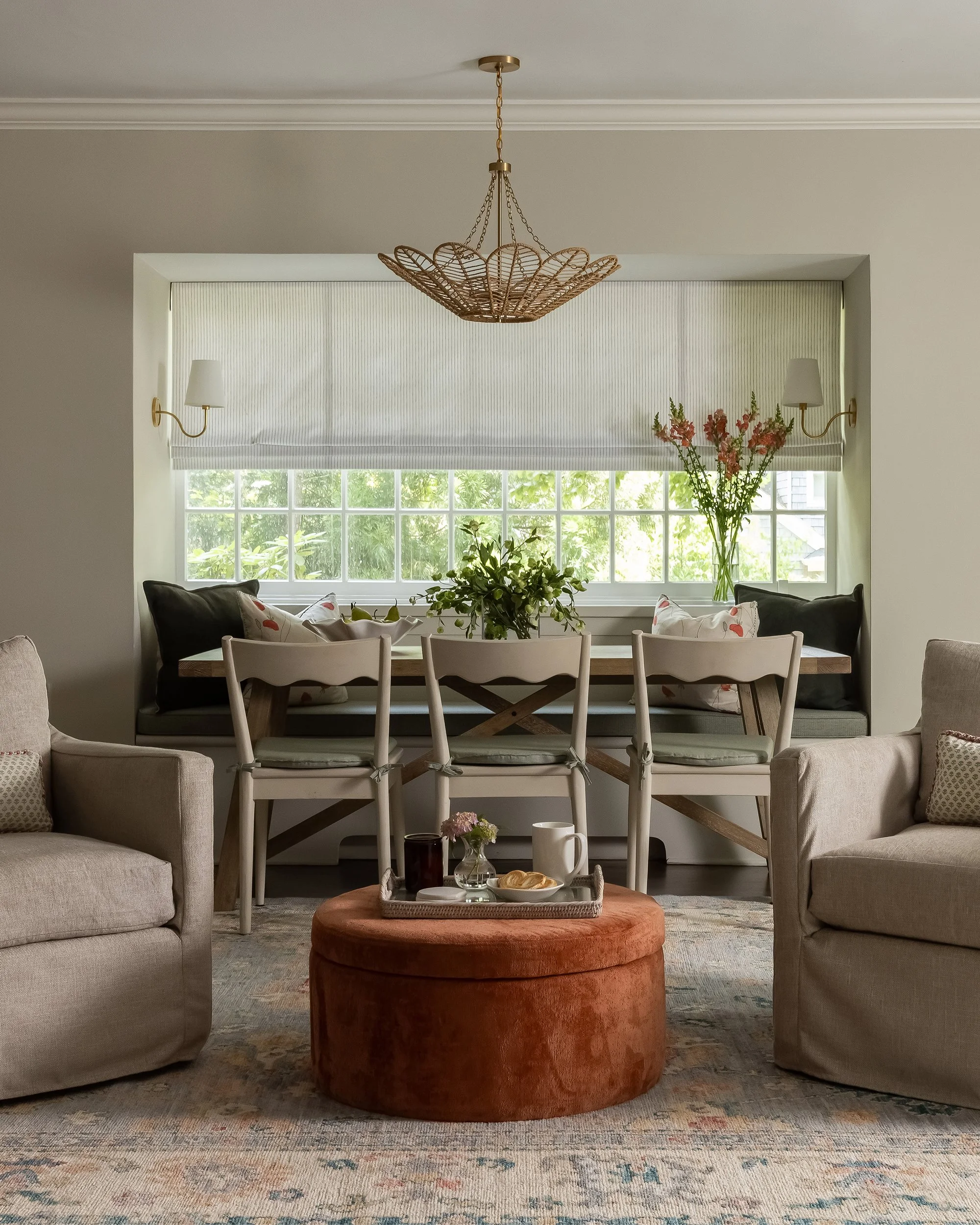 Dining room with brass chandelier and wainscoting by Raquel Langworthy