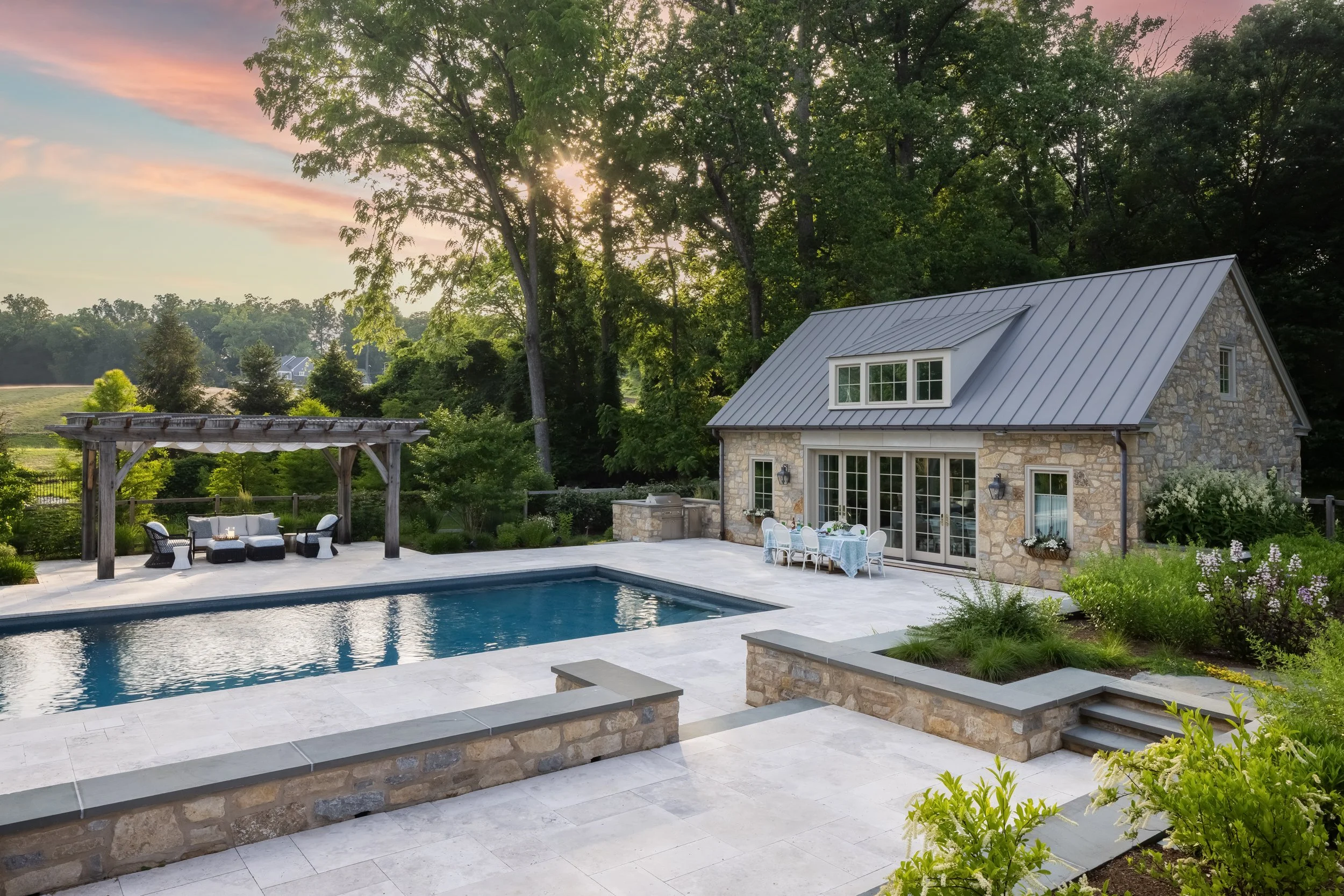 Aerial view of backyard pool and landscaping by Raquel Langworthy