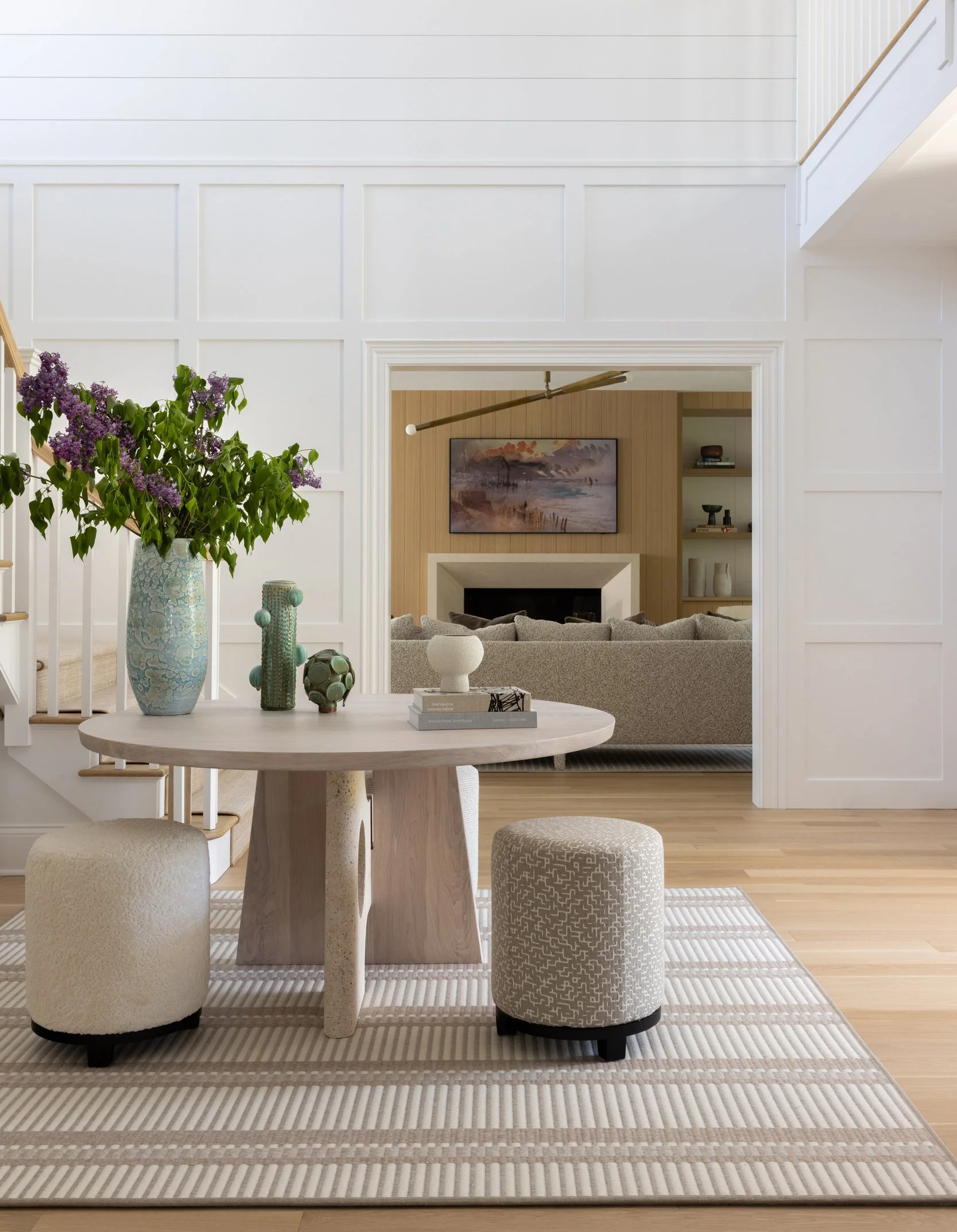 Bright entryway with console table and vase by Raquel Langworthy