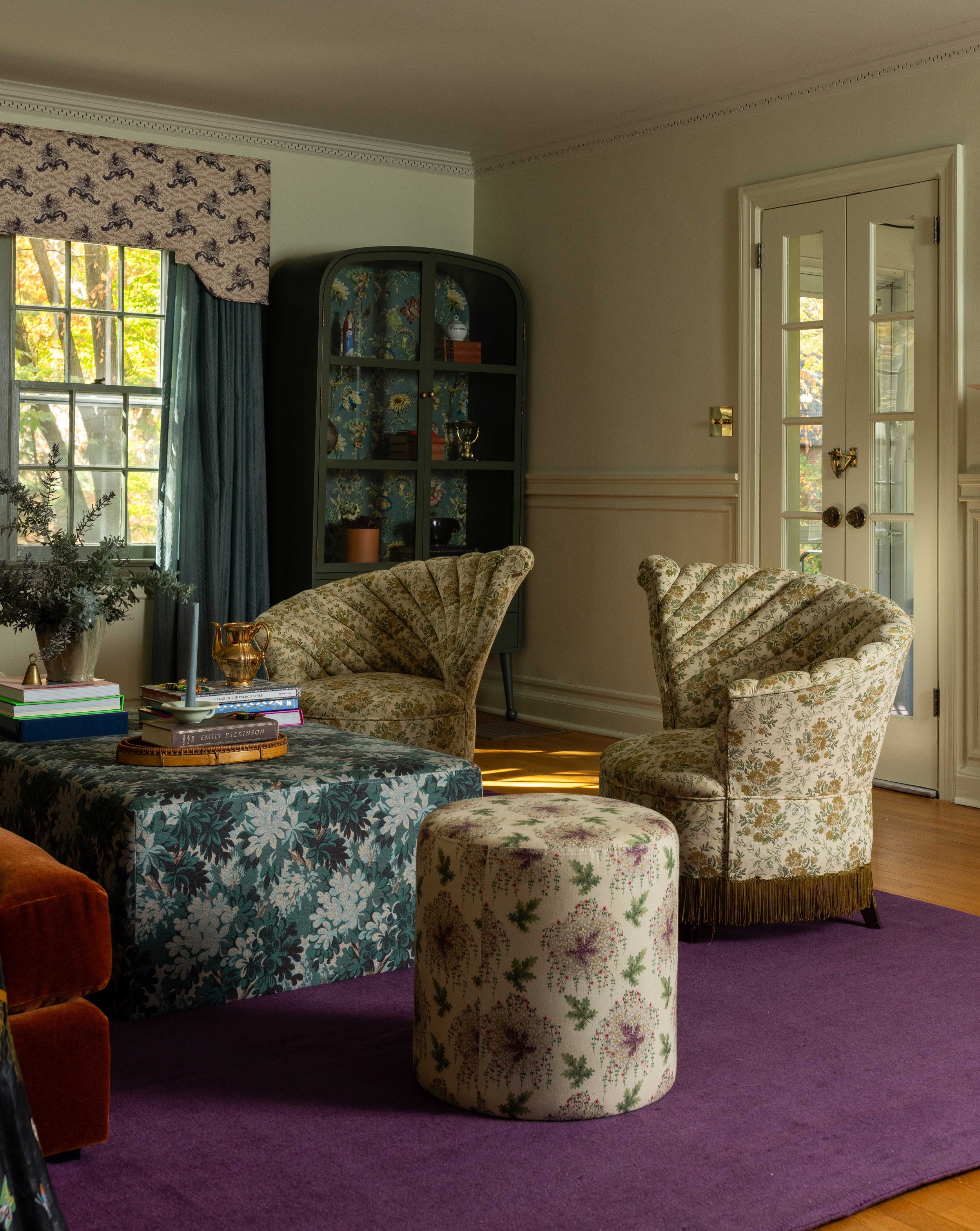 Eclectic sitting room with floral armchairs by Raquel Langworthy