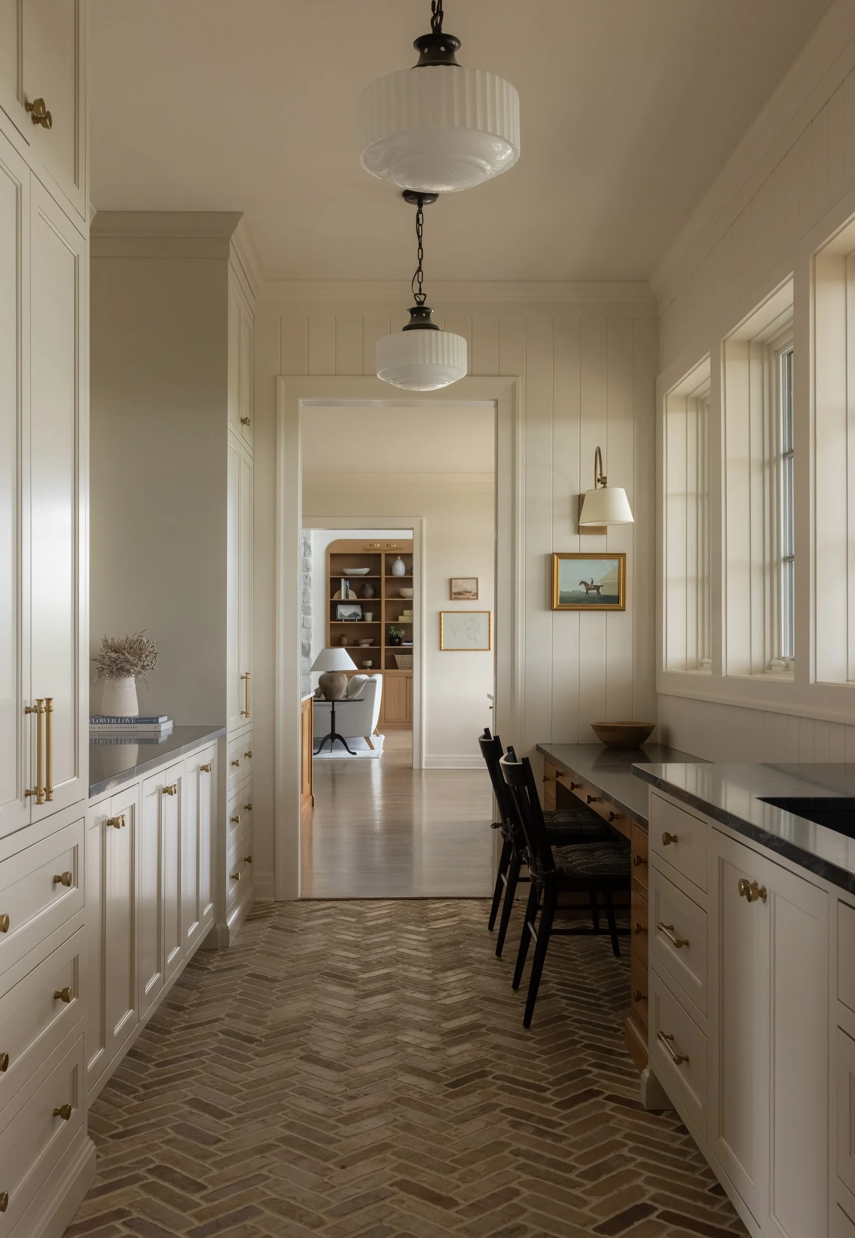 Bright white hallway with pendant light by Raquel Langworthy