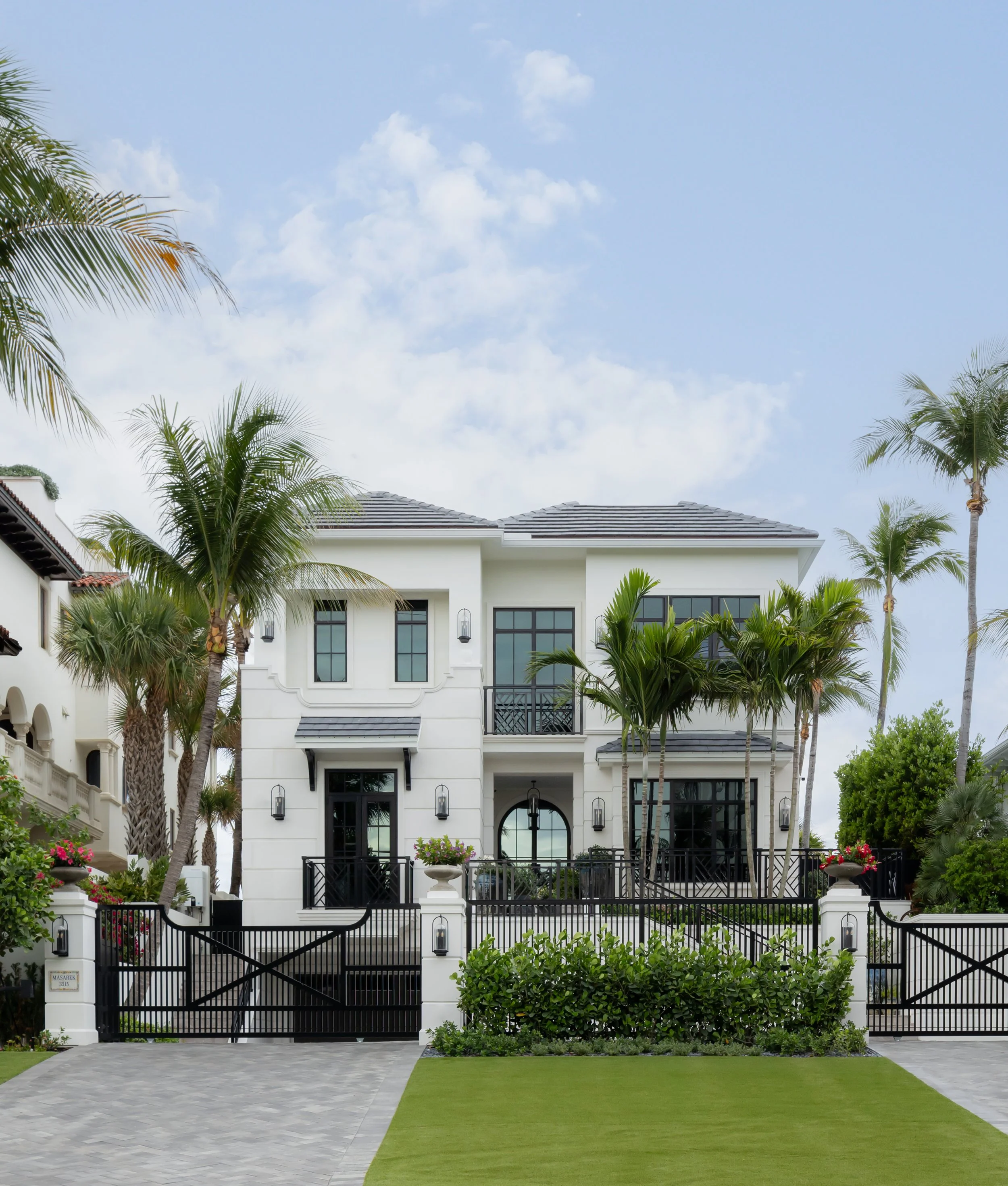 White colonial luxury home exterior by Raquel Langworthy
