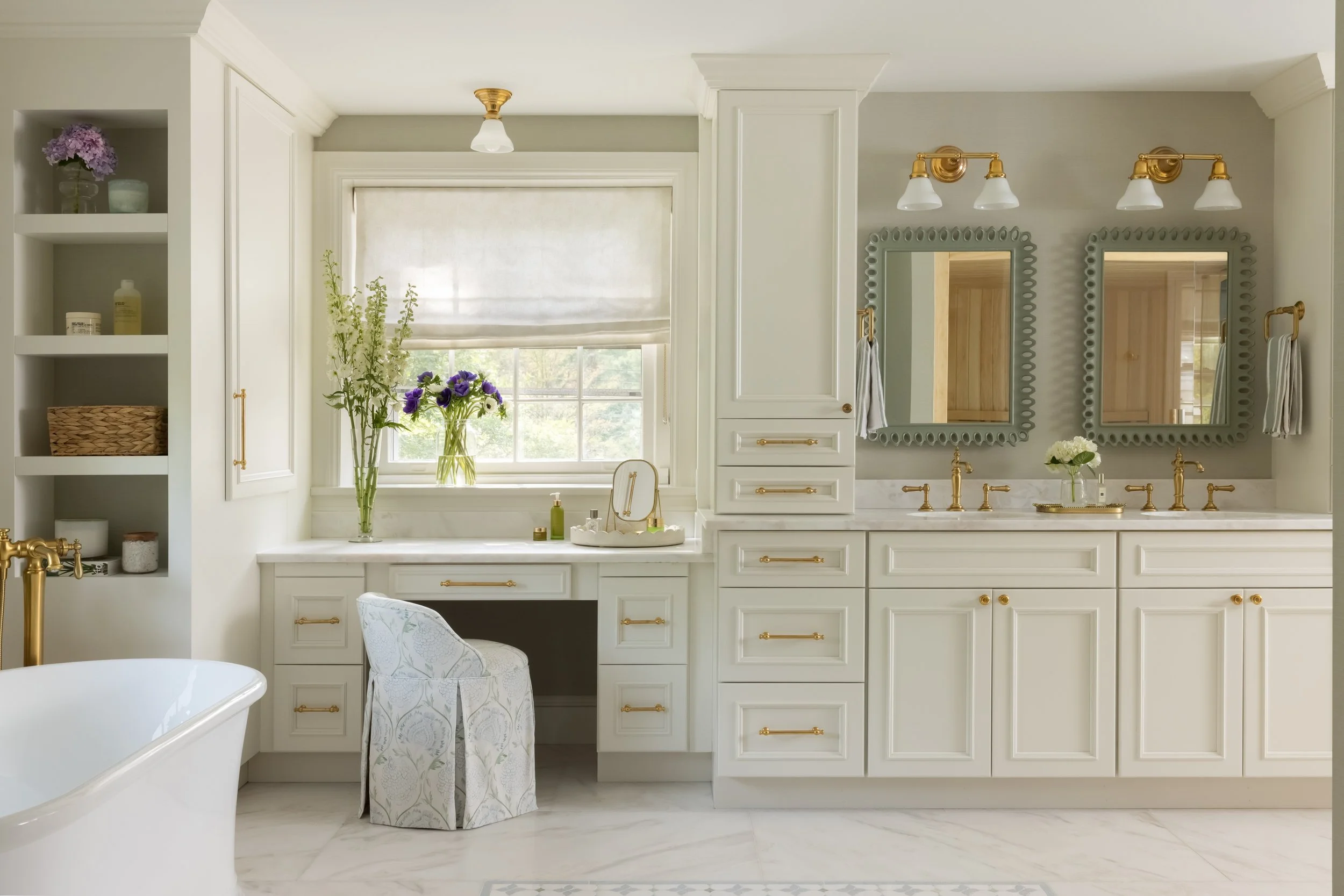 Bright white kitchen with window and pendant light by Raquel Langworthy