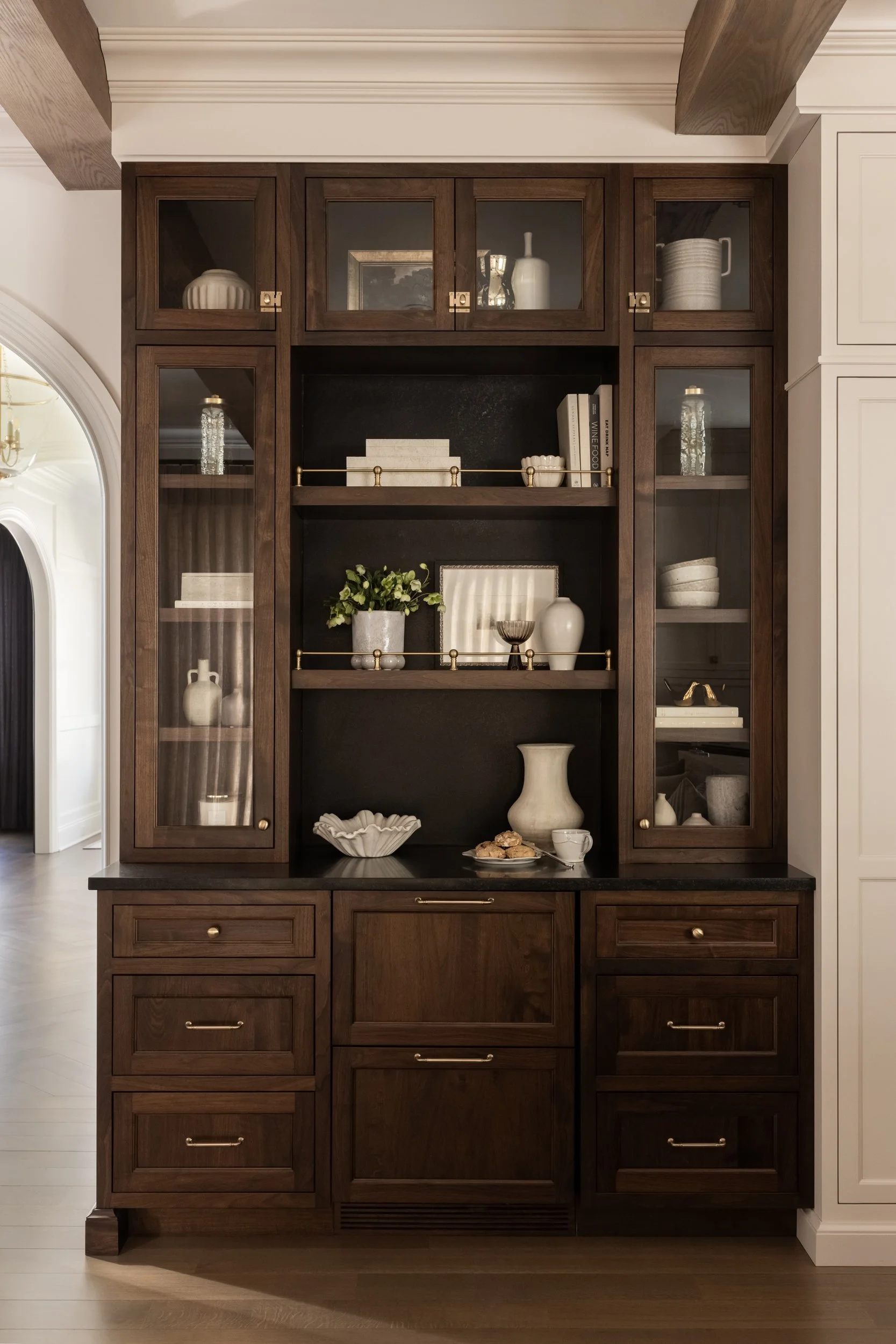 Dark wood built-in display cabinet by Raquel Langworthy