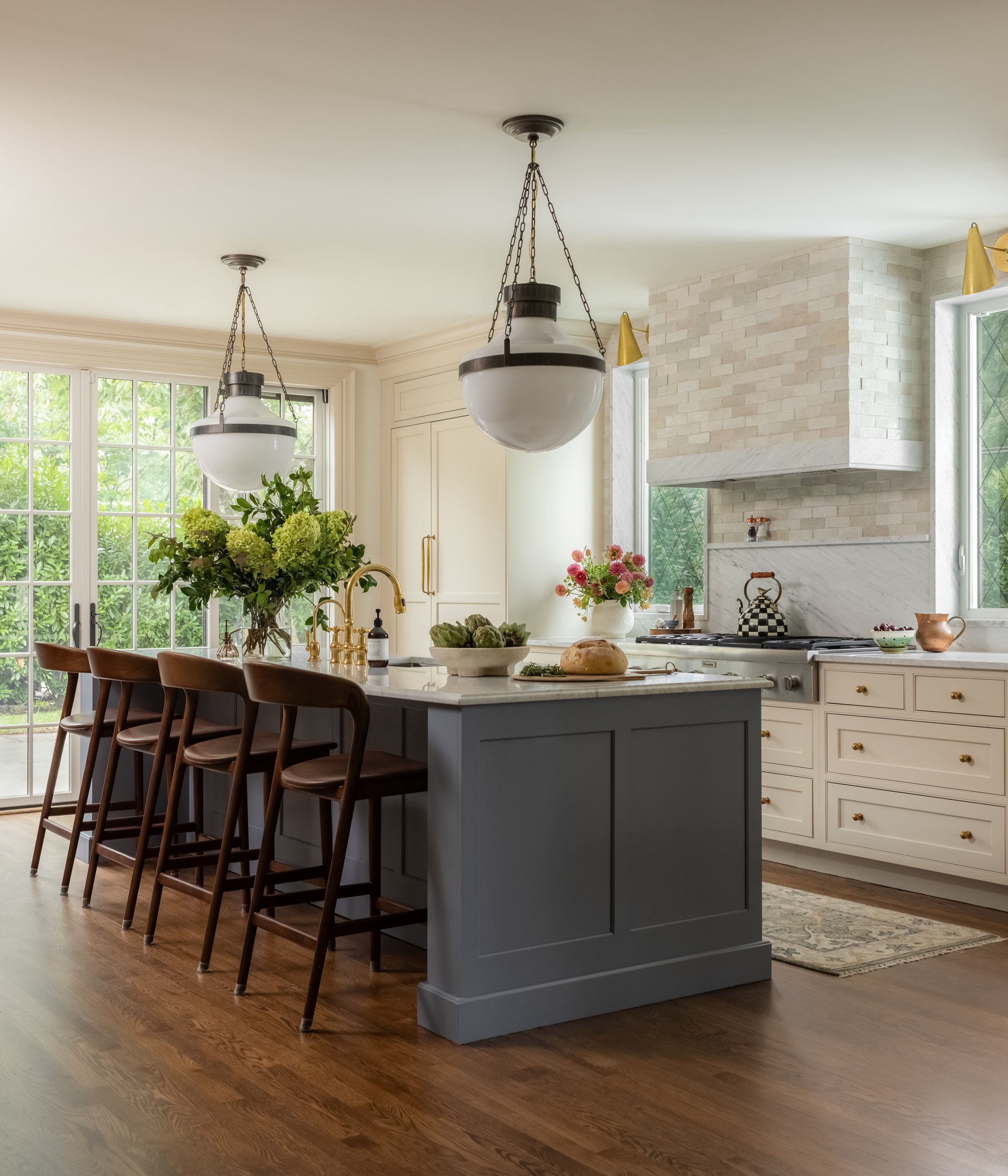 Bright kitchen with pendant light by Raquel Langworthy