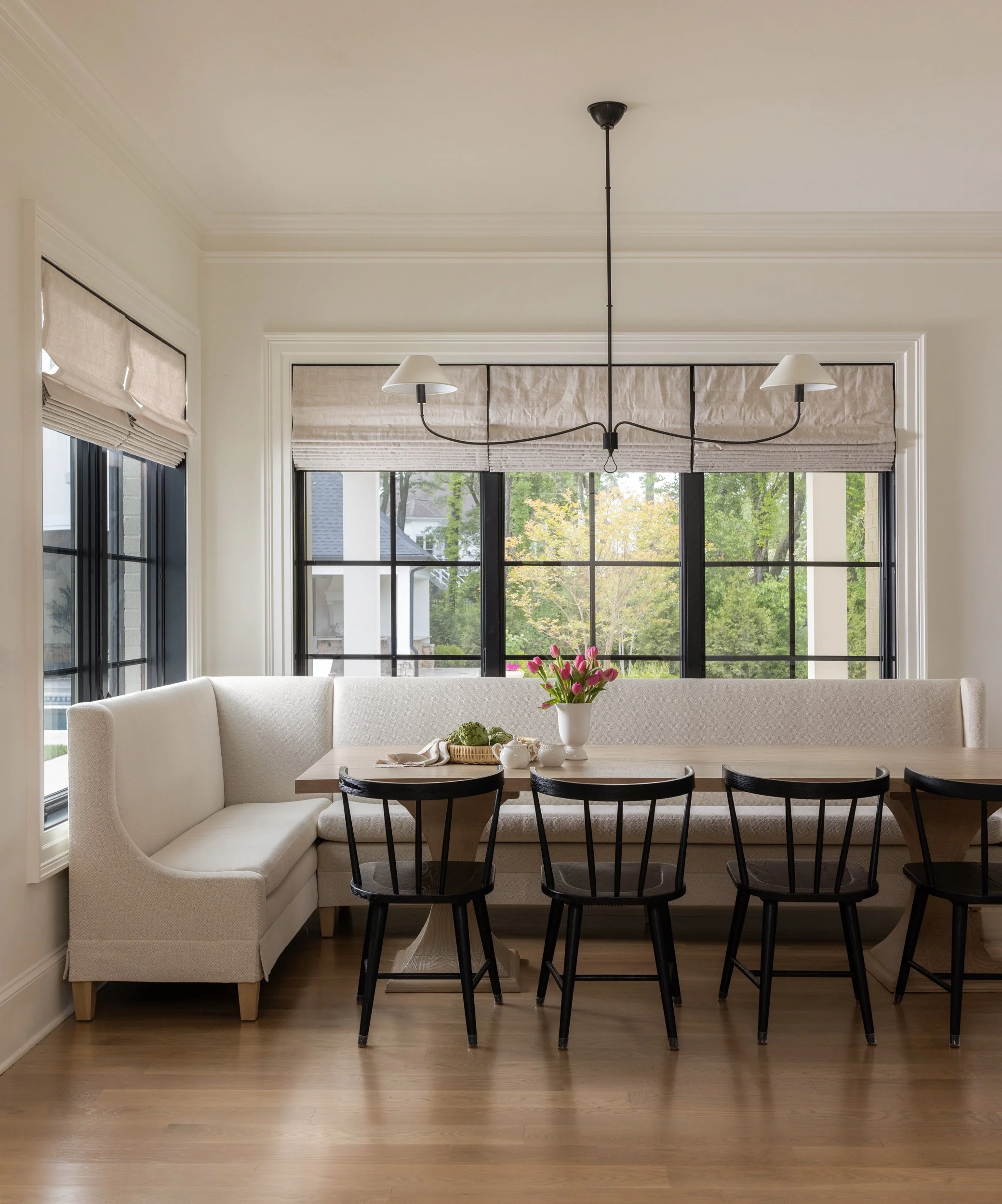 Minimalist neutral room with floor lamp by Raquel Langworthy