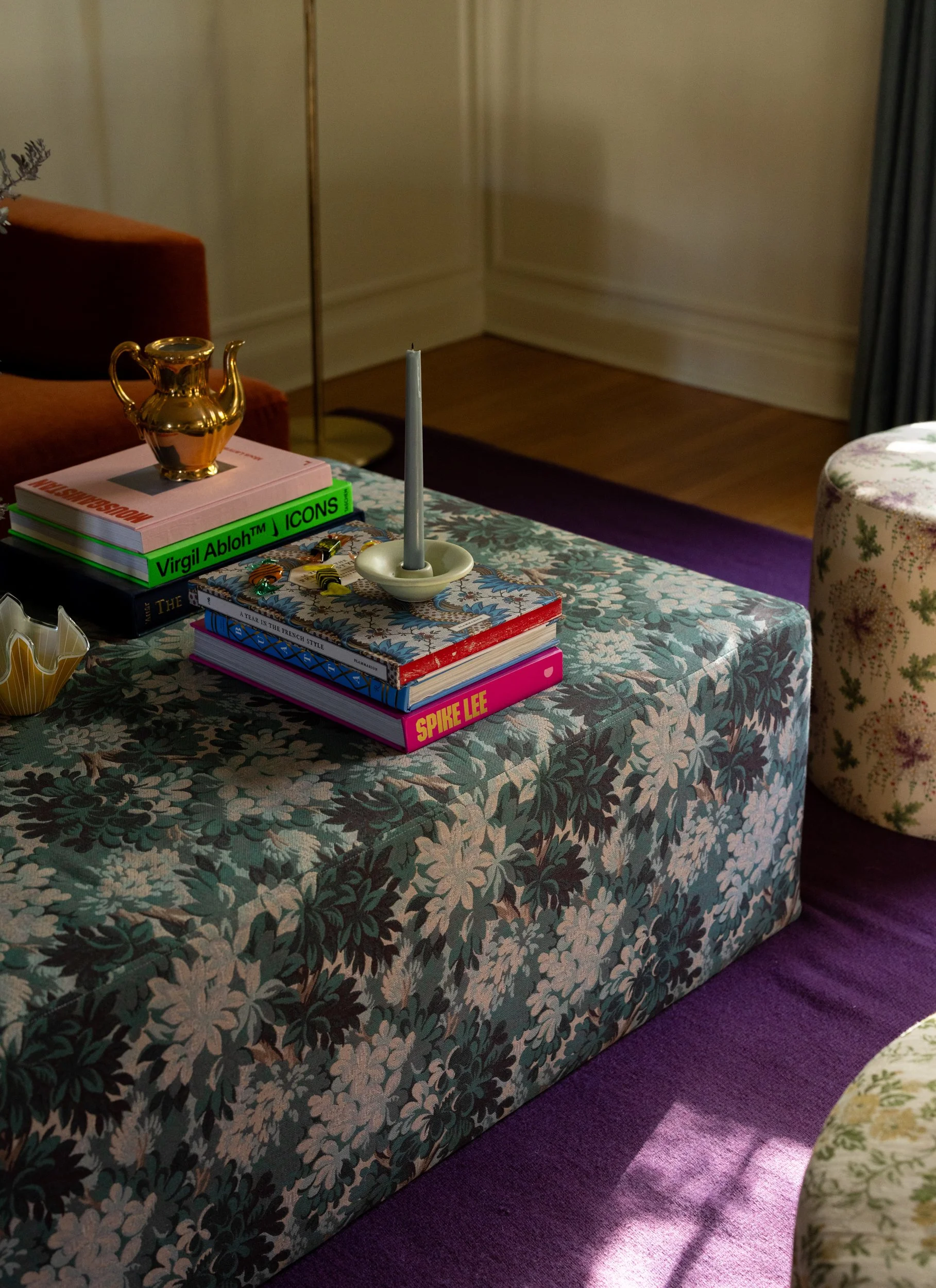 Dark green room with floral tablecloth by Raquel Langworthy