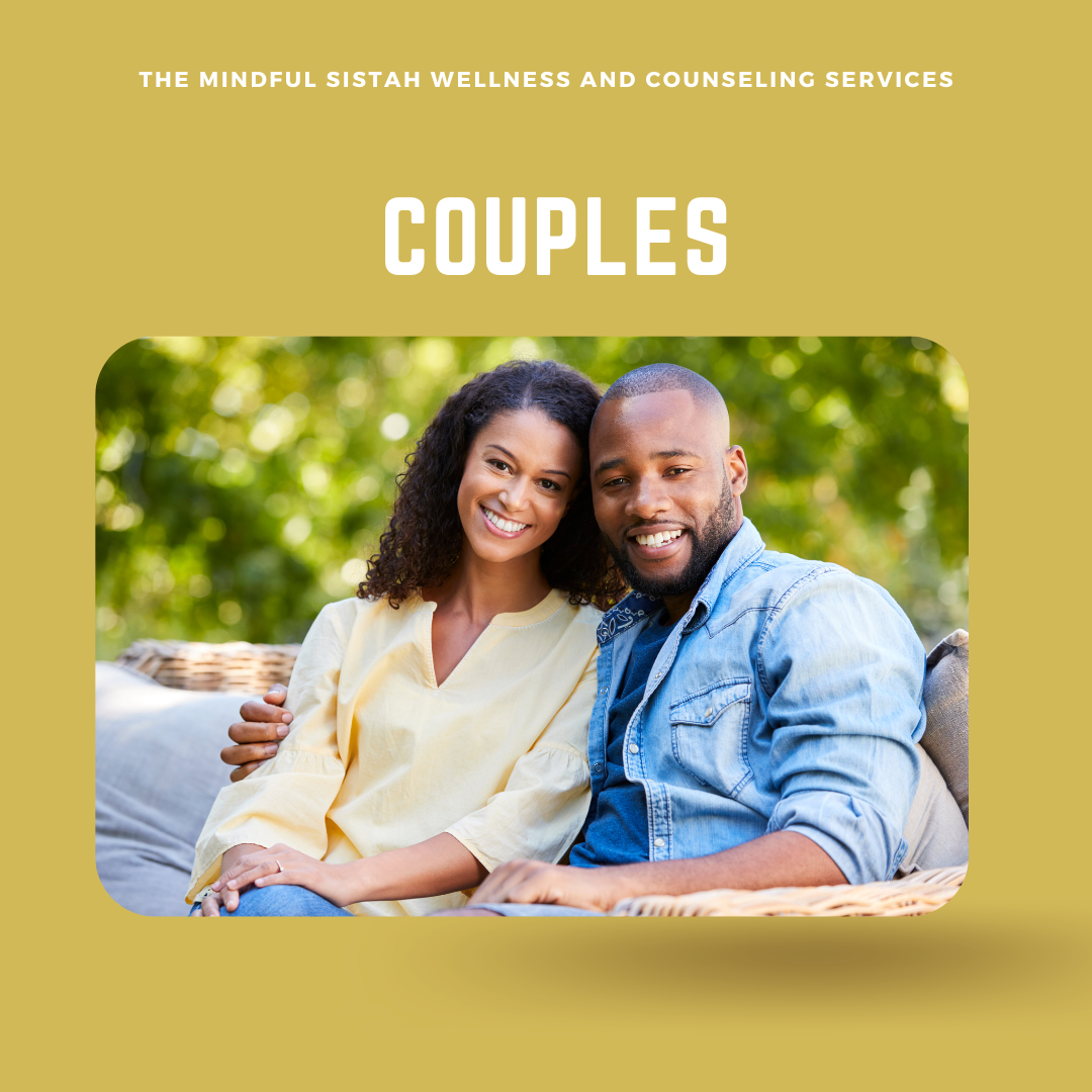 A smiling couple sitting closely together outdoors with green trees in the background, representing a couple's counseling or wellness service.
