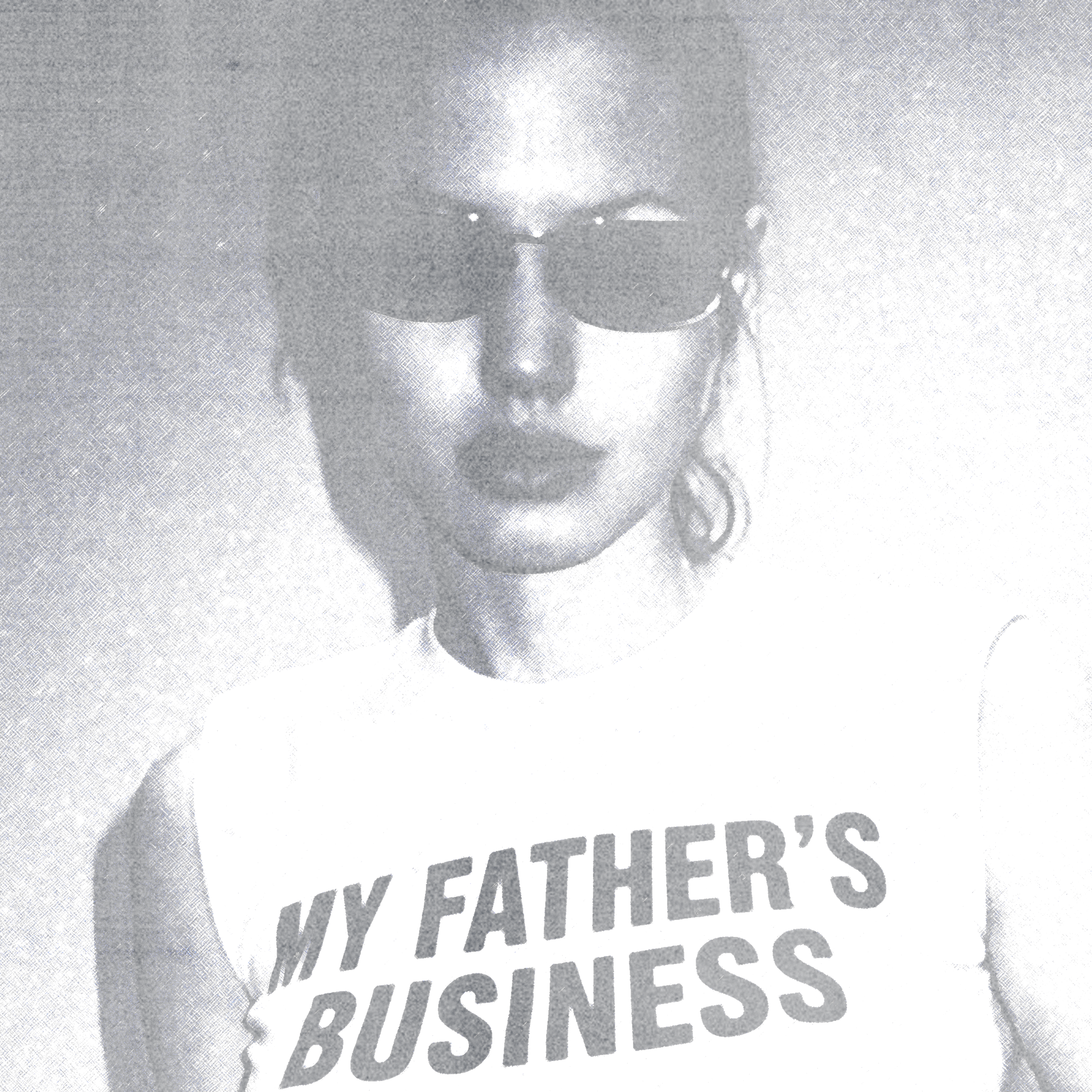 Woman wearing sunglasses and a t-shirt that says, "My Father's Business".