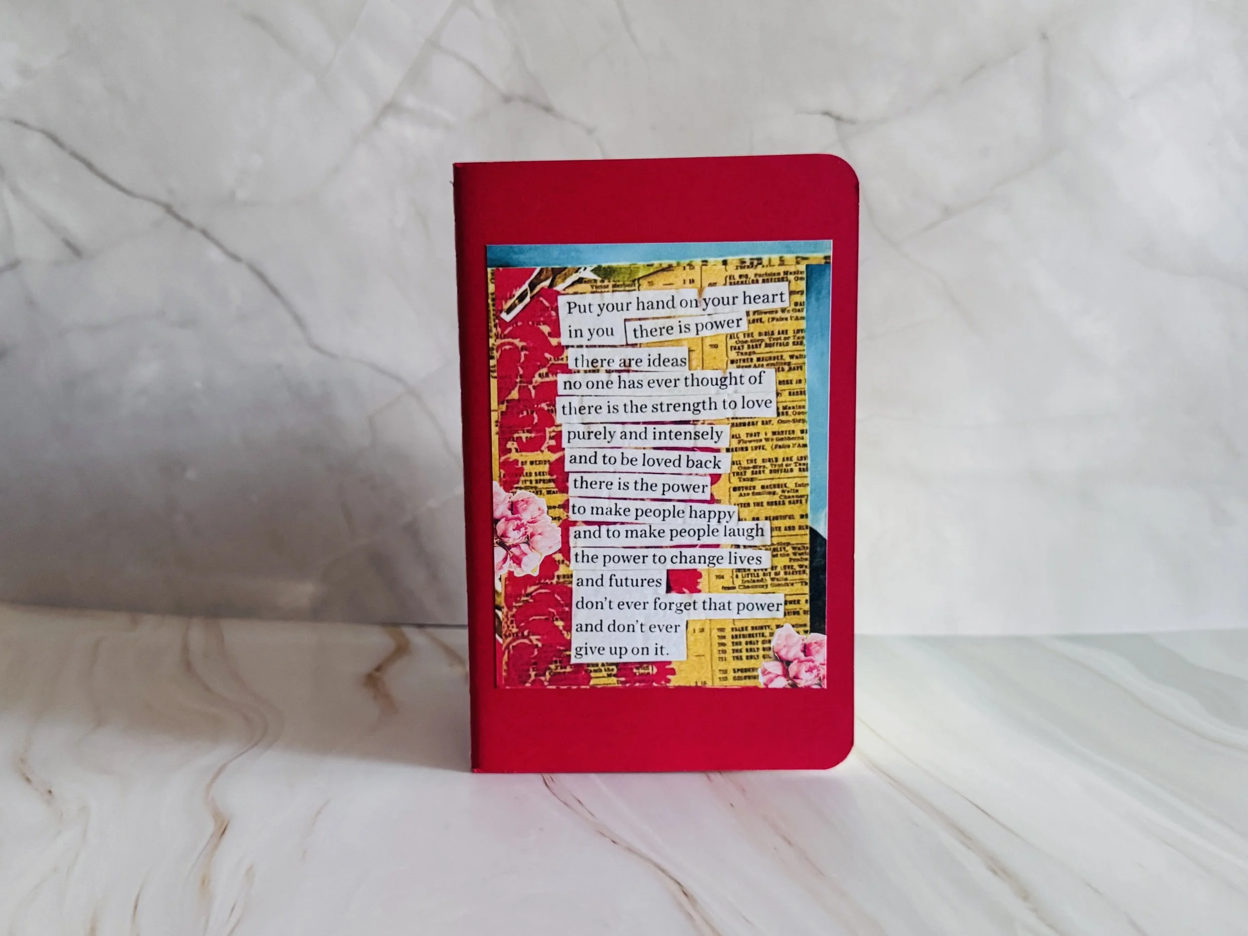 hand on heart pocket notebook