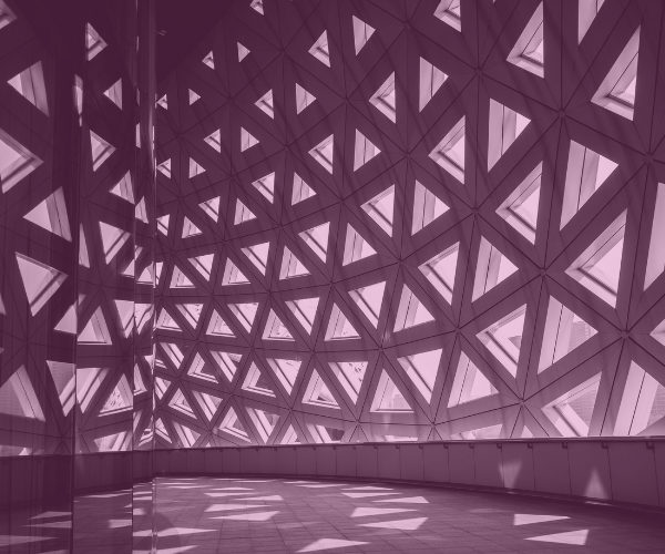 The inside of a building with many triangular windows.