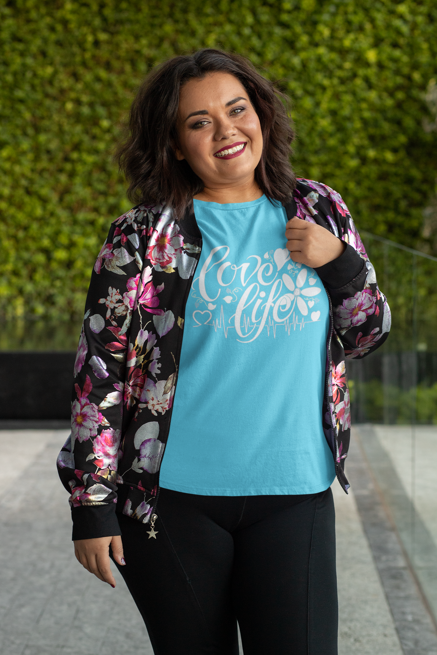 BLUE plus-size-t-shirt-mockup-featuring-a-joyful-woman-posing-in-front-of-a-leafy-background-31077.png