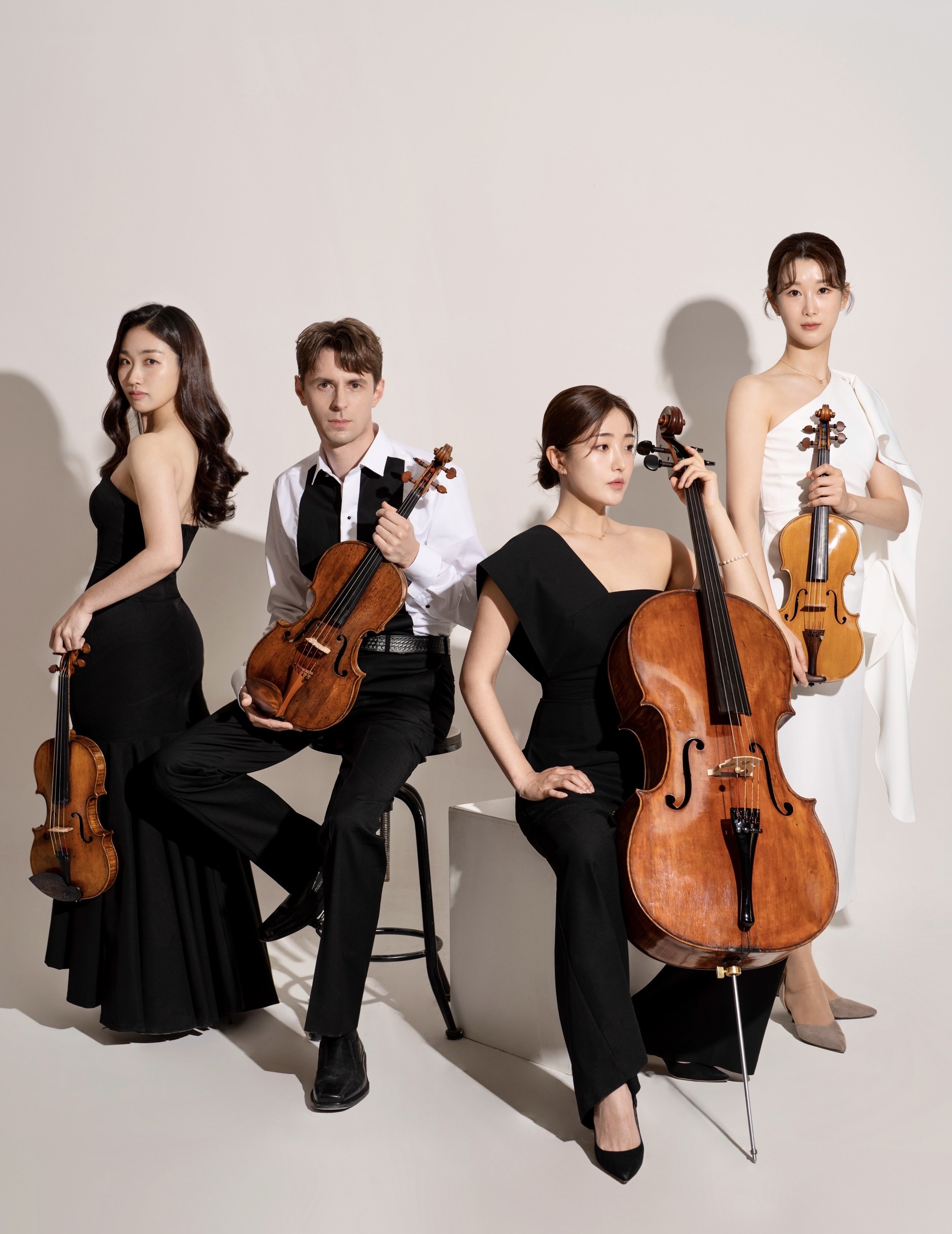 Esme Quartet headshots with instruments