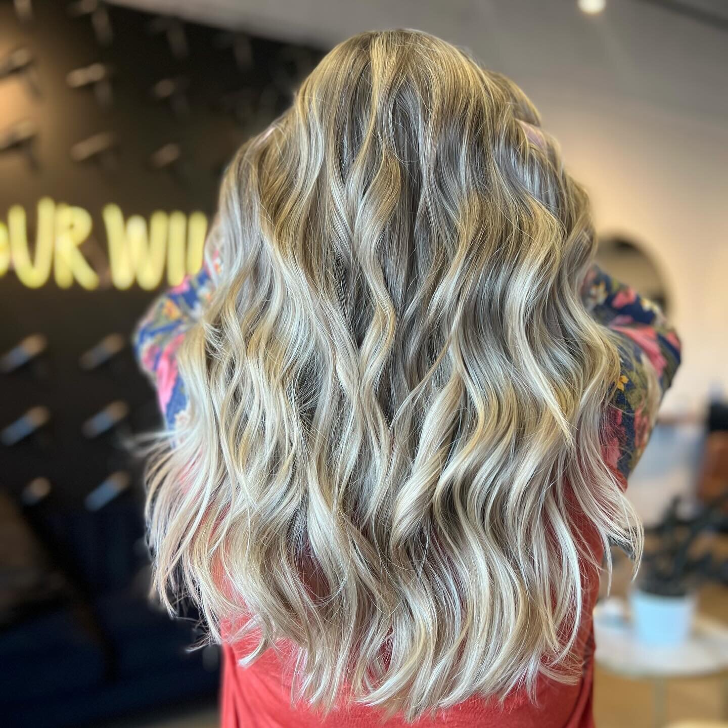 Golden blonde highlights paired with beach waves can create a stunning and effortless look. To achieve this style, you can follow these steps:

1. Start by applying a heat protectant spray to your hair to protect it from the heat of styling tools.

2