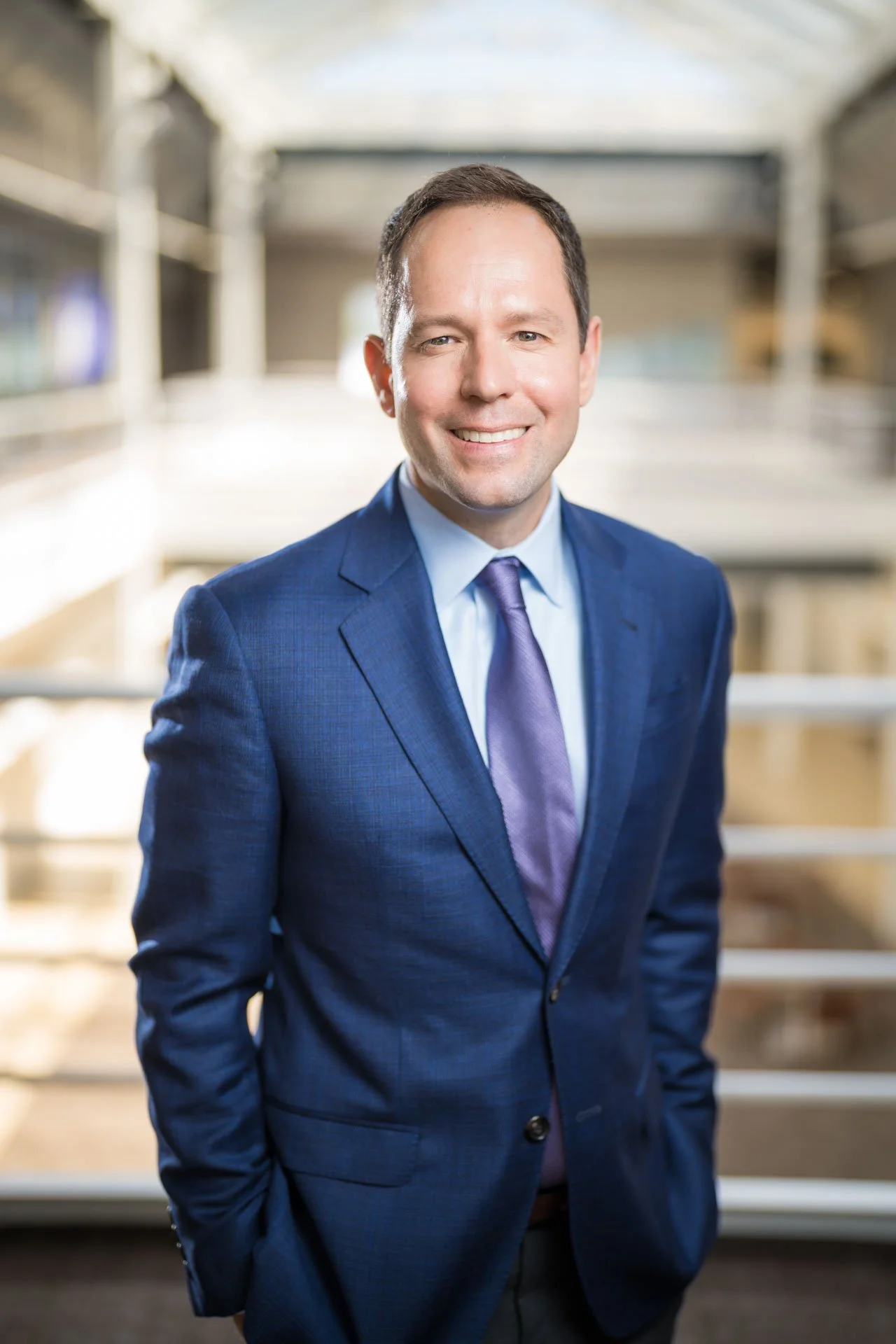 Professional executive portrait of man in blue suit.