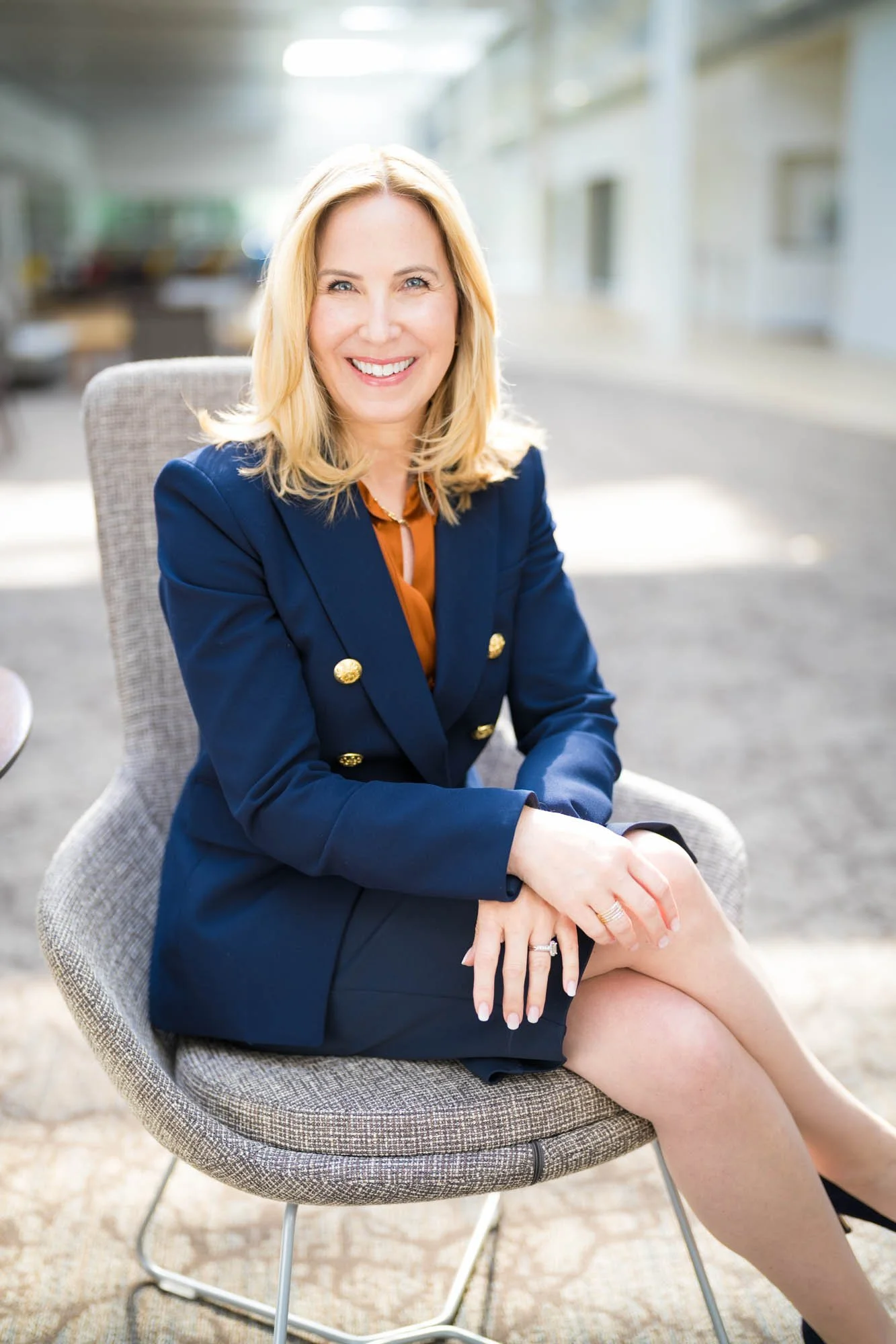 Professional executive portrait of a CEO, a woman in blue suit.