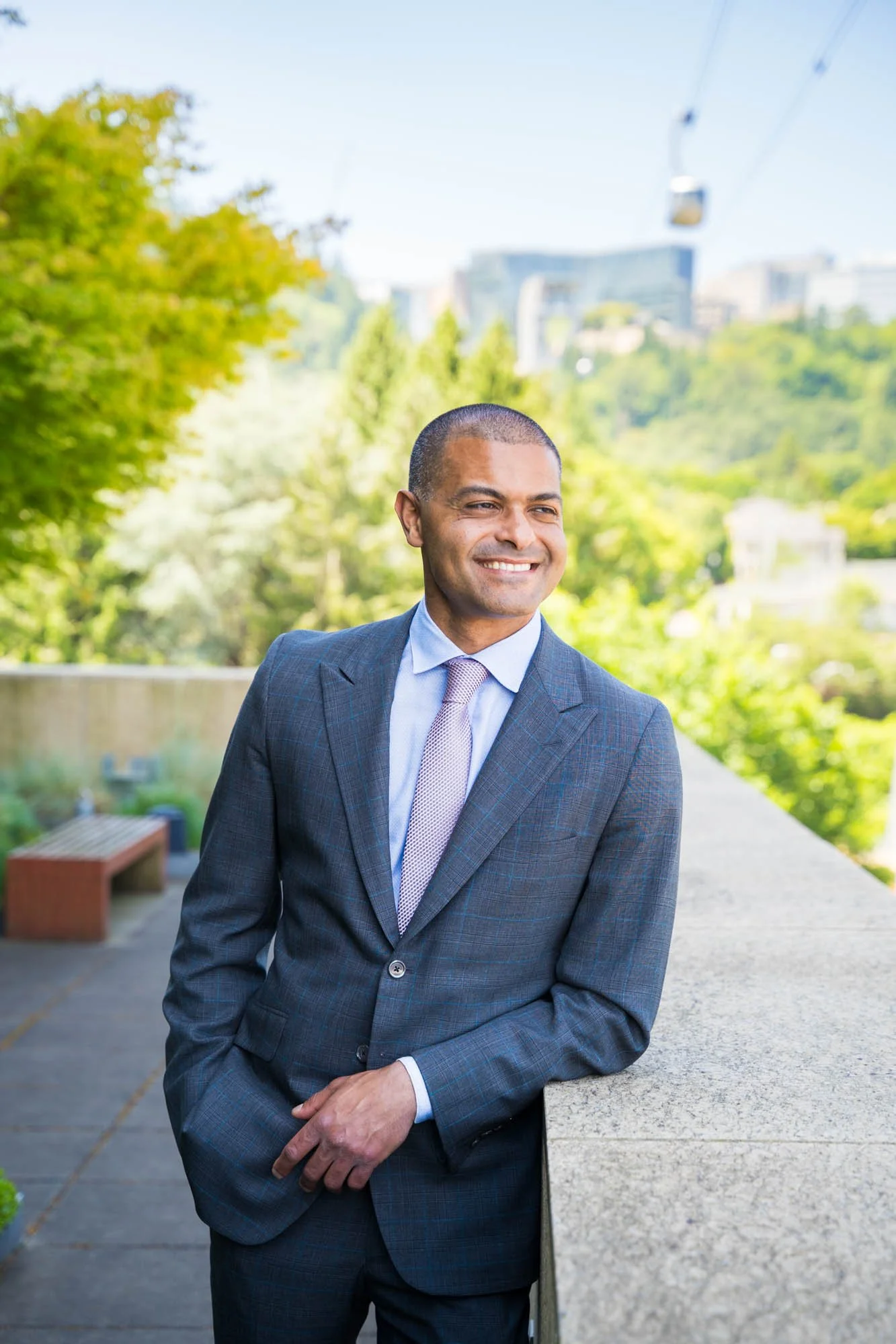 Professional executive portrait of a CEO, a man in blue suit outside at OHSU.