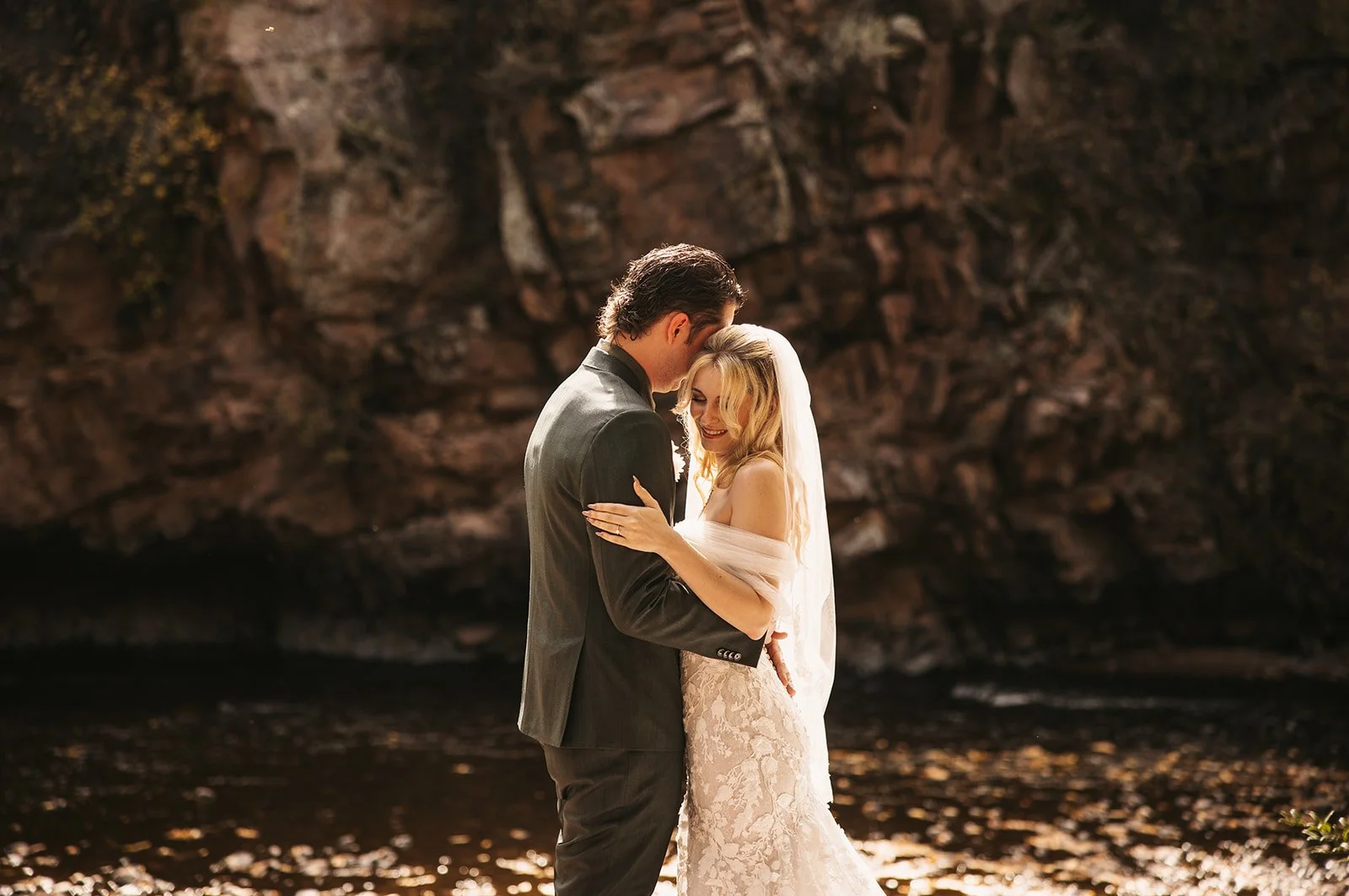 sarah+dylan-EmilyElizabethPhoto-Oct2025-bride-groom-river.jpg