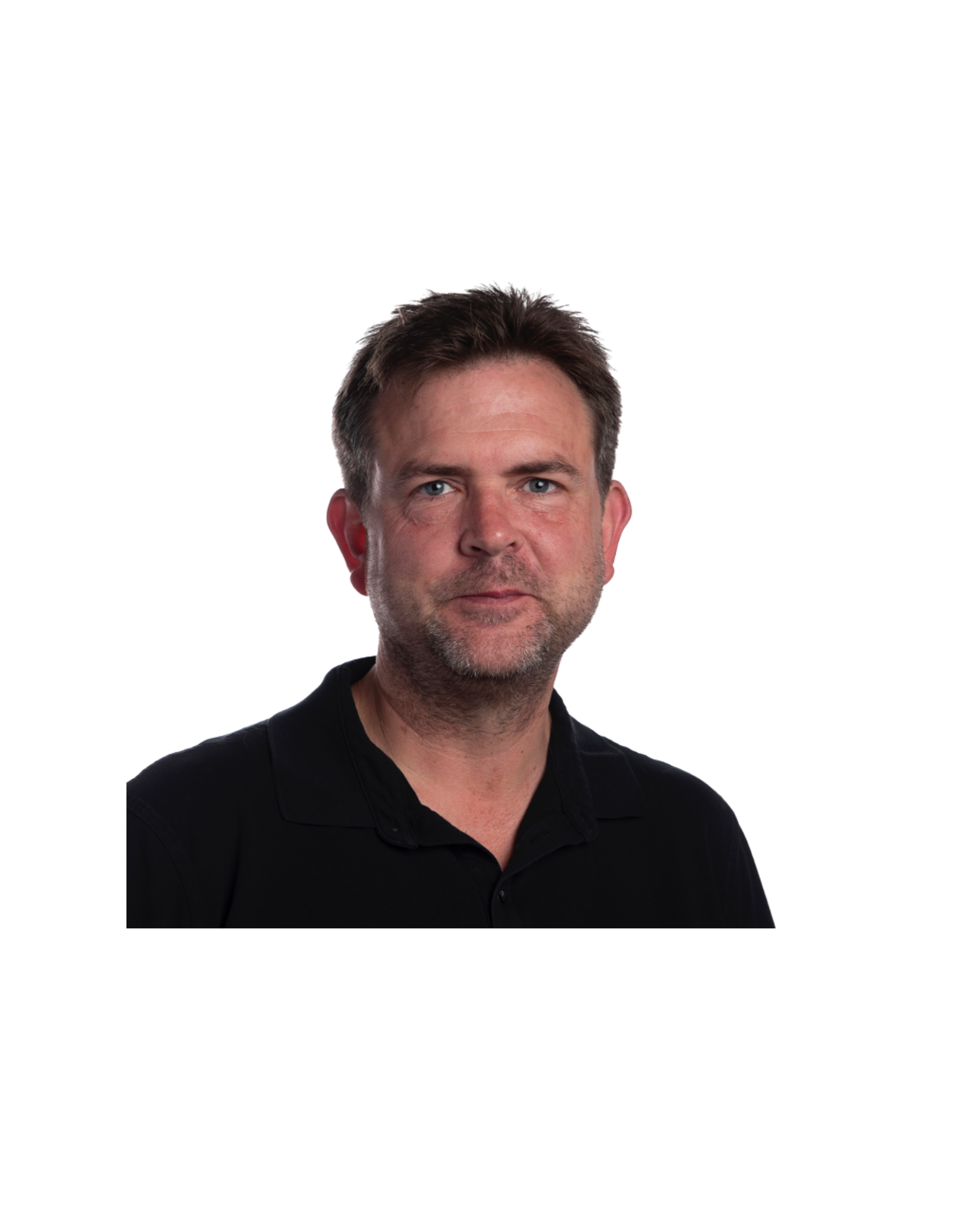 Photo of a man with short brown hair, blue eyes, and light stubble, wearing a black shirt, against a black background with colorful lines.
