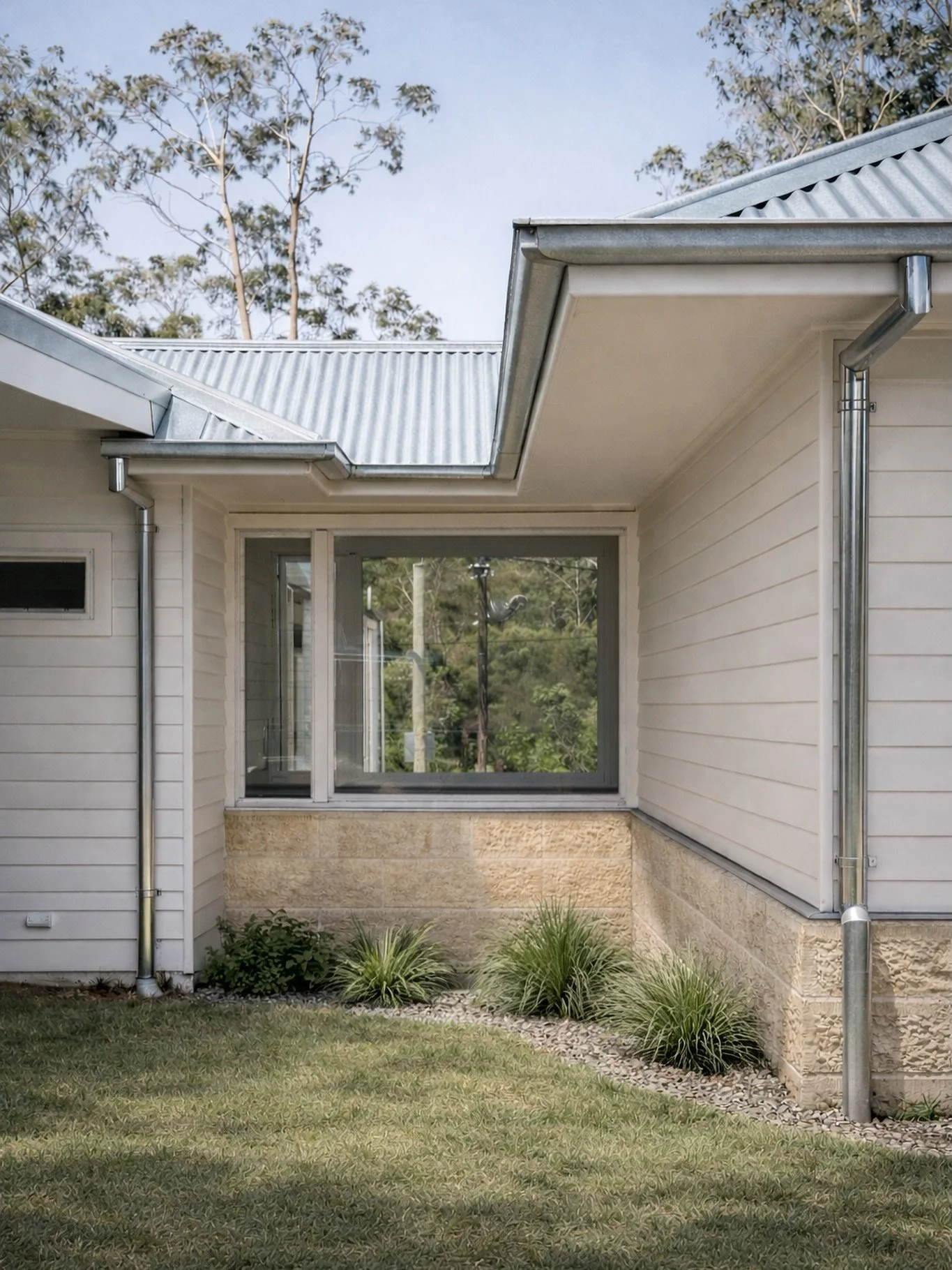 MacDonald River &mdash; 
A subtle glass connection between the original cottage into the new extension, keeping the transition simple and intentional.