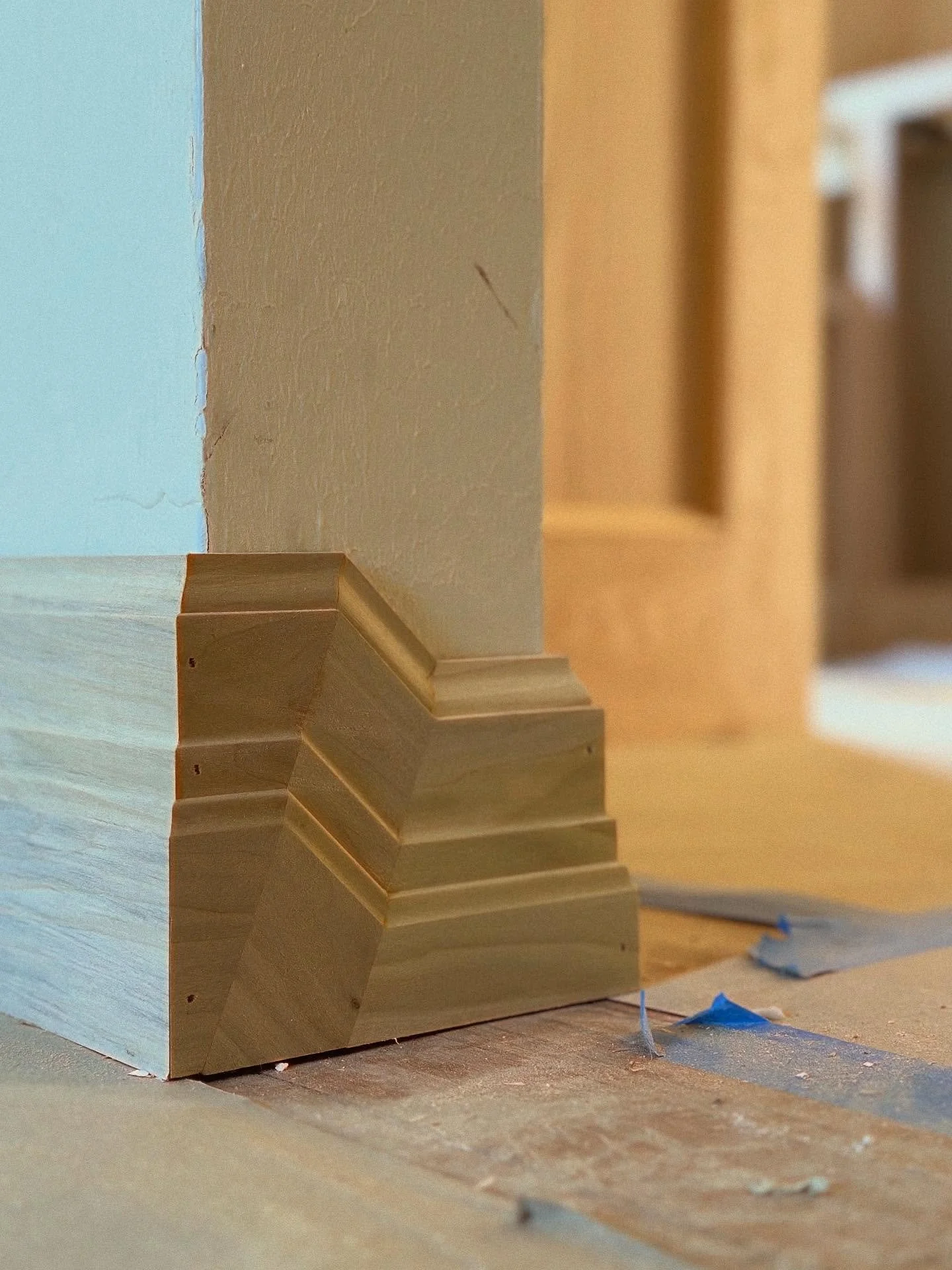A home&rsquo;s character is often found in its finishing touches and few details speak of craftsmanship quite like a well fitted baseboard.

Here, a mitered wooden baseboard is being installed. The angled joint carefully cut to create a seamless conn