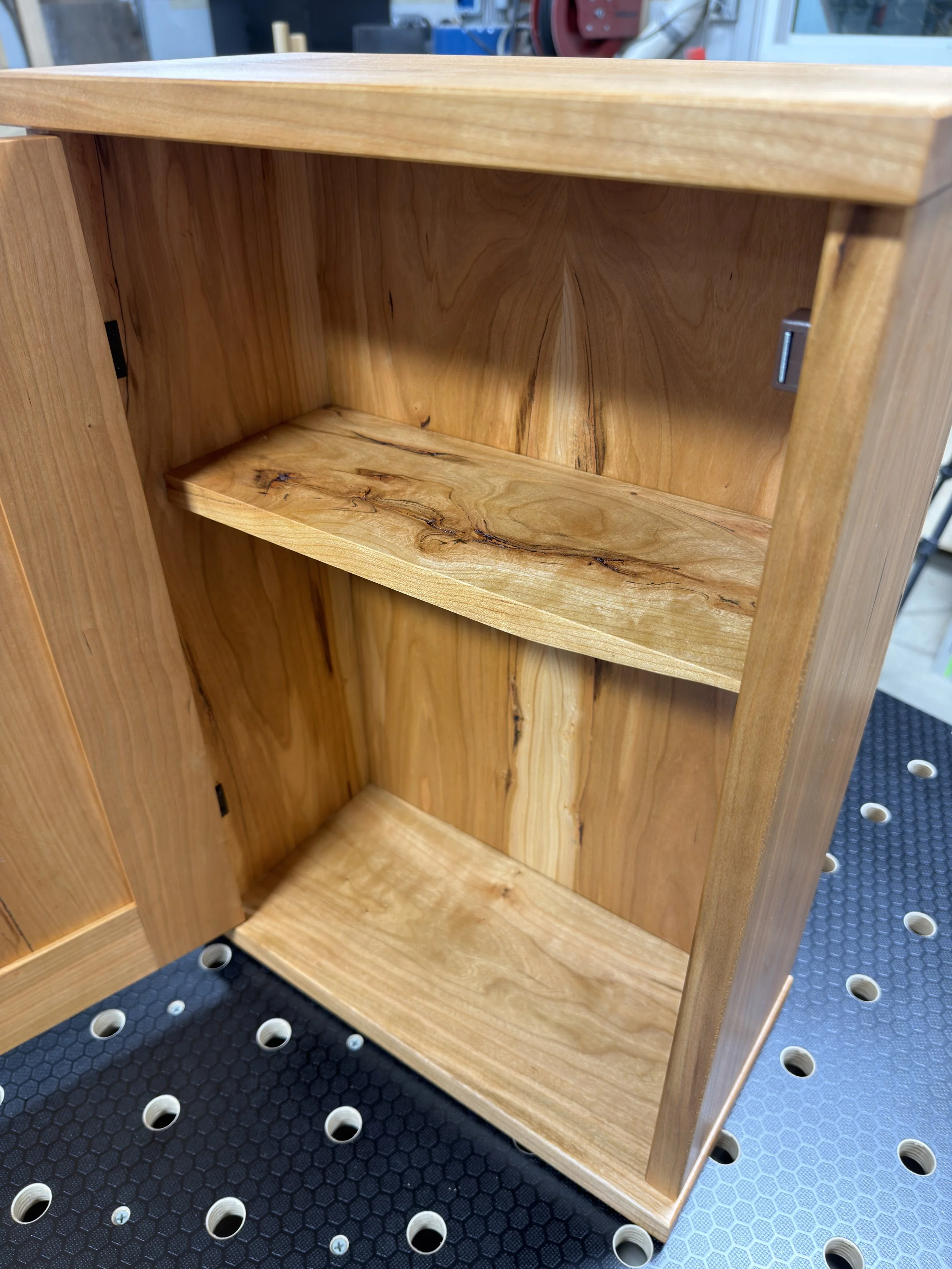 Crafted From Solid Cherry Hardwood, This Cabinet Features A Book-Matched Solid Back Panel, And A Solid Core Shaker Styled Front Door