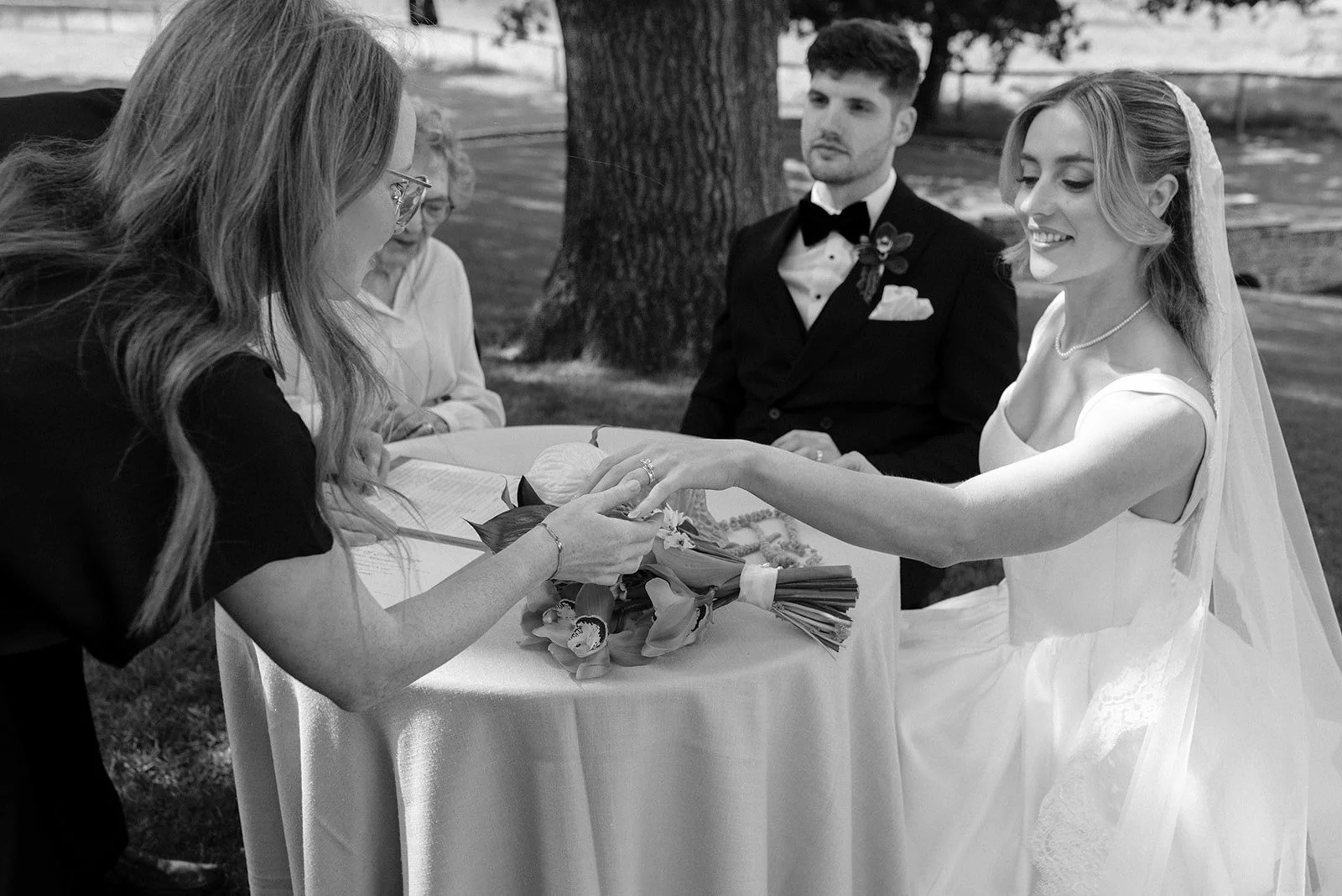One of my favourite moments in the entire ceremony happens right here, at the signing table.

The guests are watching, but for a minute it feels private. The vows are done, the rings are on, and I get to quietly ask: how do you feel?

The answers are