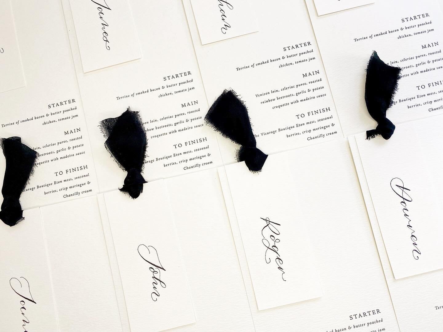 Minimalist wedding menus with black silk ribbon and handwritten modern calligraphy for K &amp; H 🤍🖤

All the on the day stationery I do is bespoke, if you would like to work with me on your stationery this year, I still have a handful of slots avai