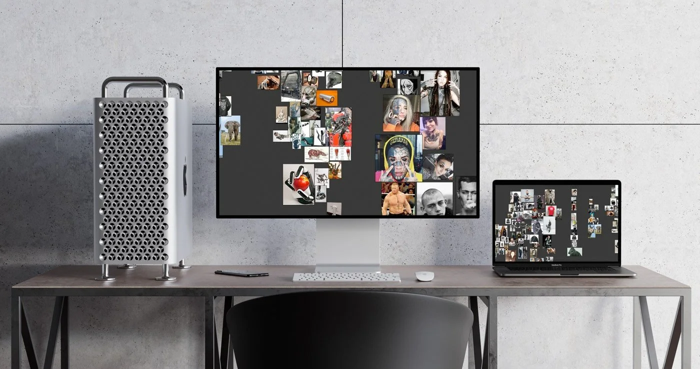 a dual monitor setup with character design references, sitting on a desk, with brutalist background.