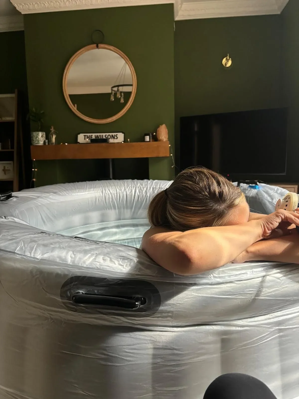 Woman using a birth pool for comfort and relaxation during labour.