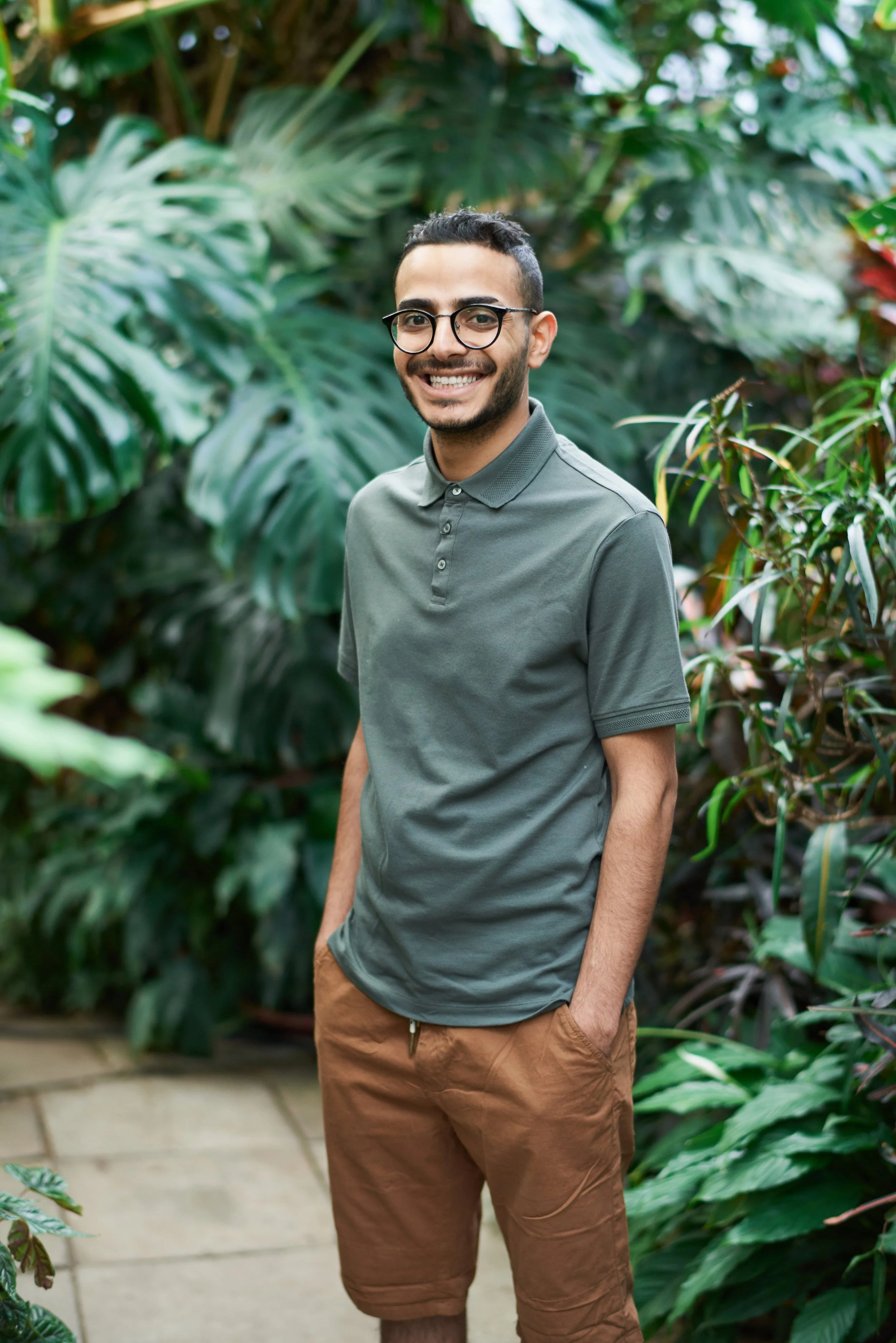  A warmly laughing man wearing glasses.