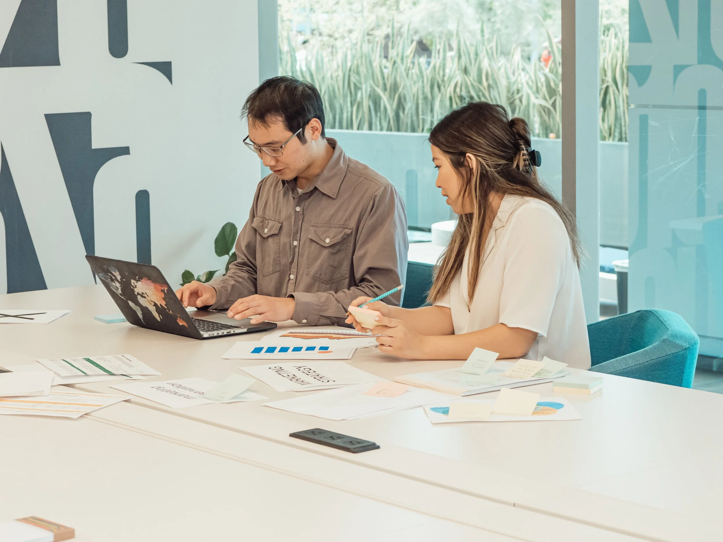 Two people working together at a table