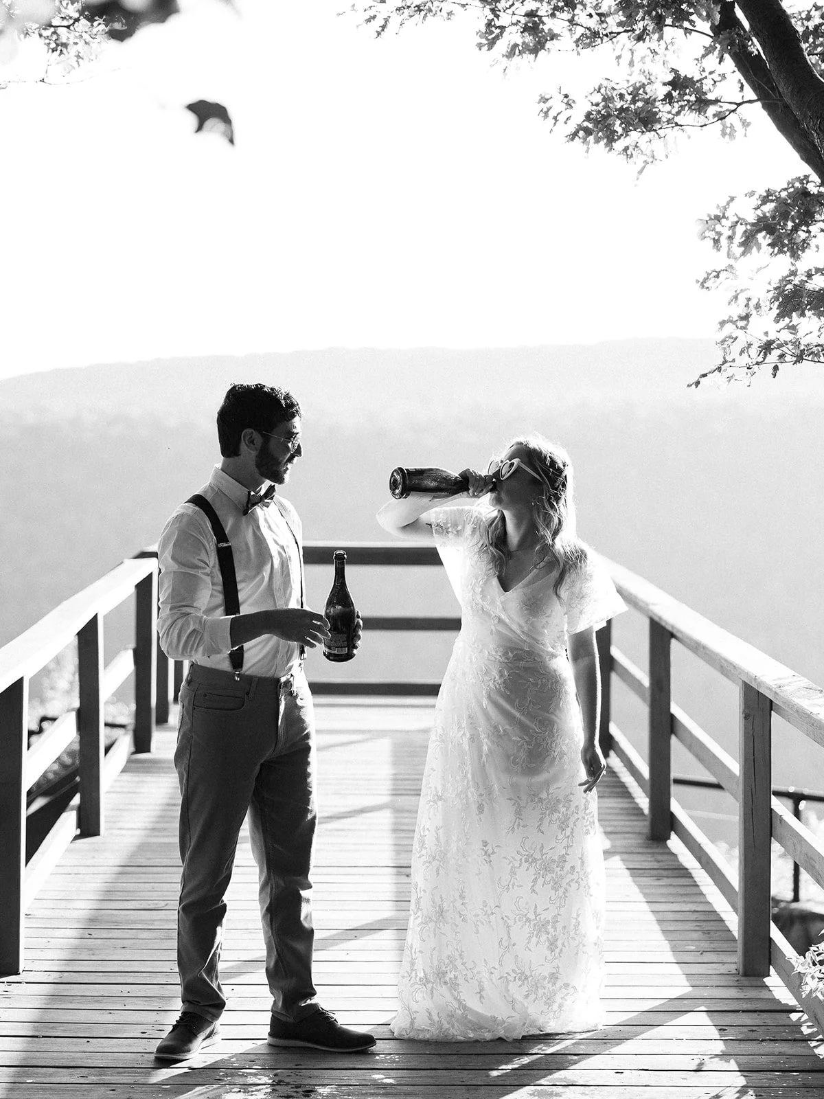 Black and white photo of a bride and groom on Mountainside during Finger Lakes Elopement
