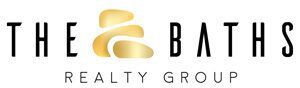 Logo for The Baths Realty Group with stylized text and a gold-colored emblem between 'The' and 'Baths'.