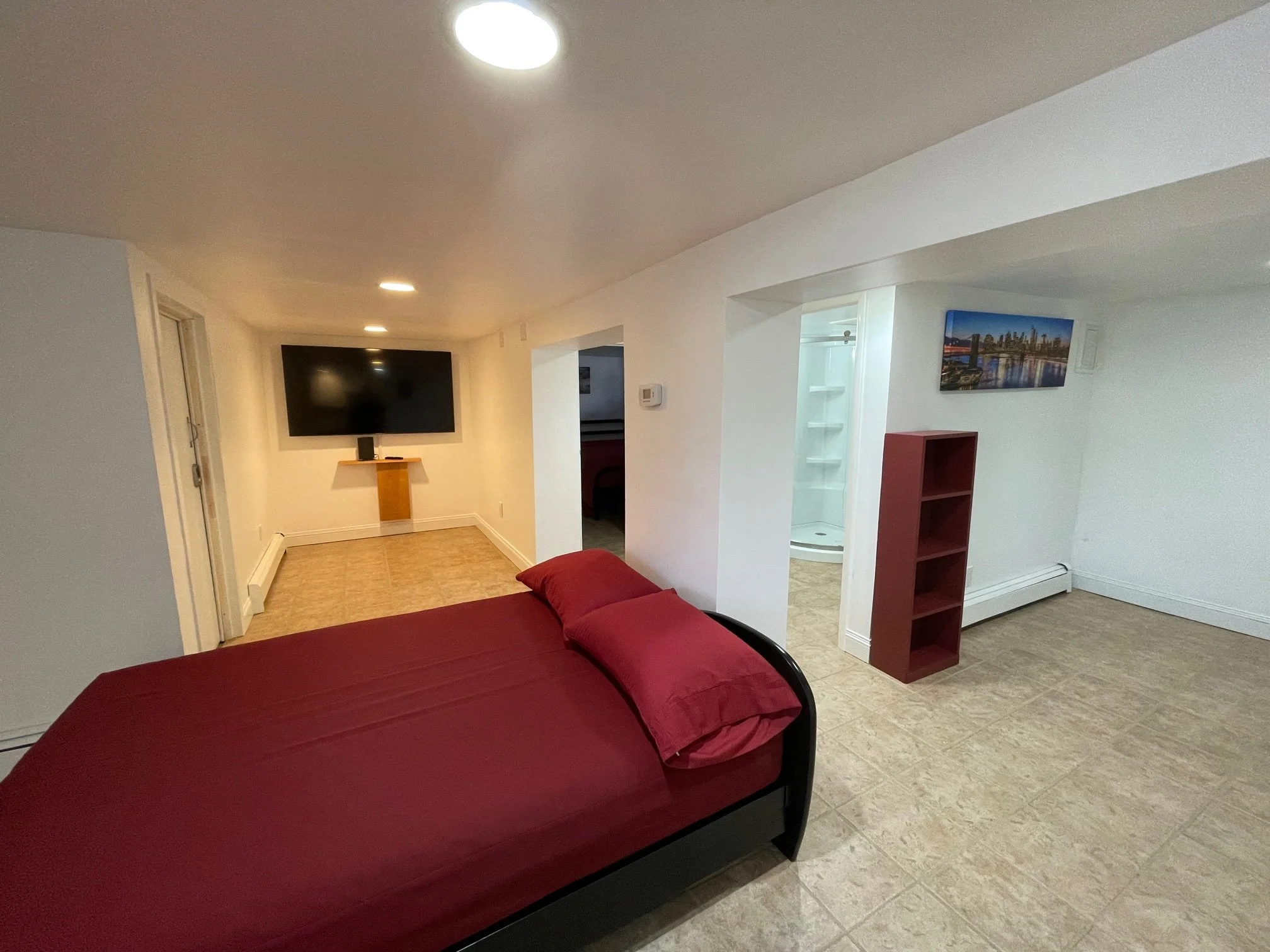 Bsmt Futon ,TV, bathrm.JPG