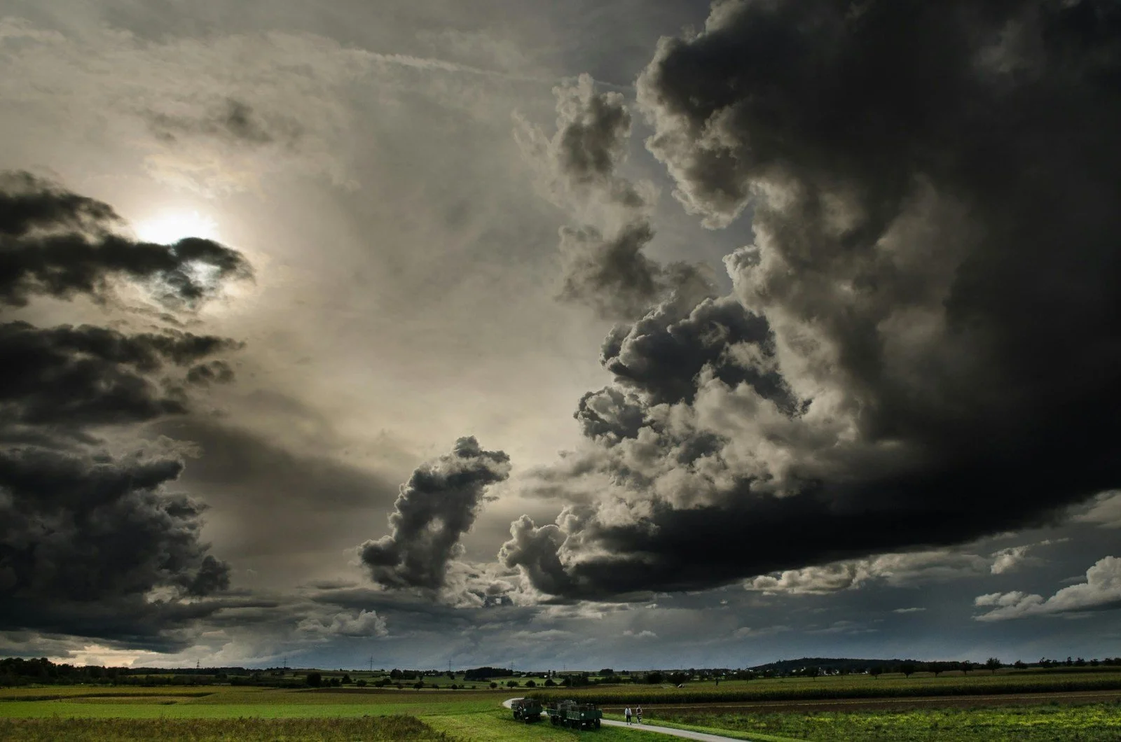 Dramatic storm clouds over a landscape—symbolizing uncertainty like inflation, healthcare costs, and policy risk in early retirement planning.