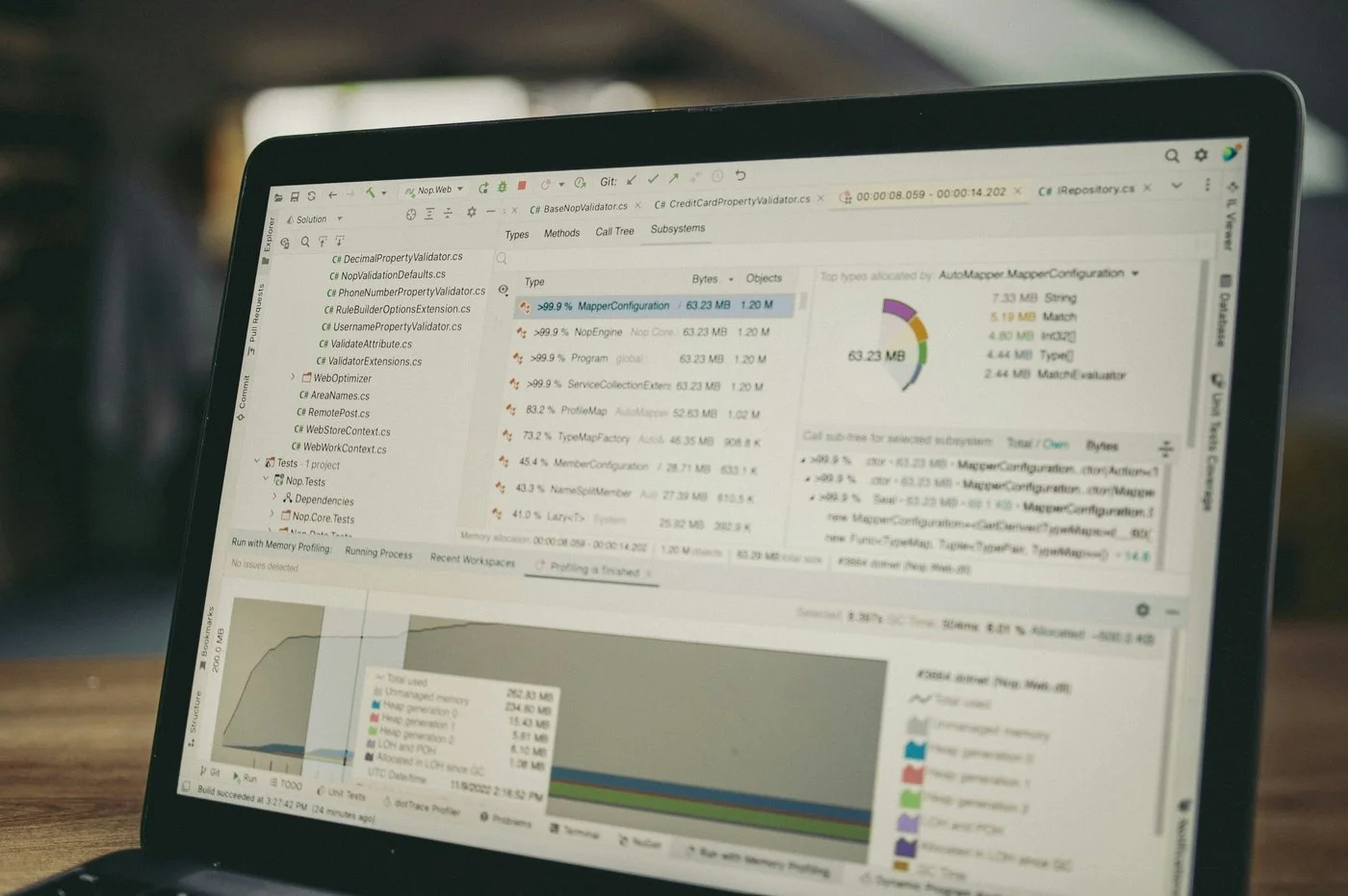 Laptop showing complex portfolio data and fund listings — representing the challenge of selecting the right ETF from many options.