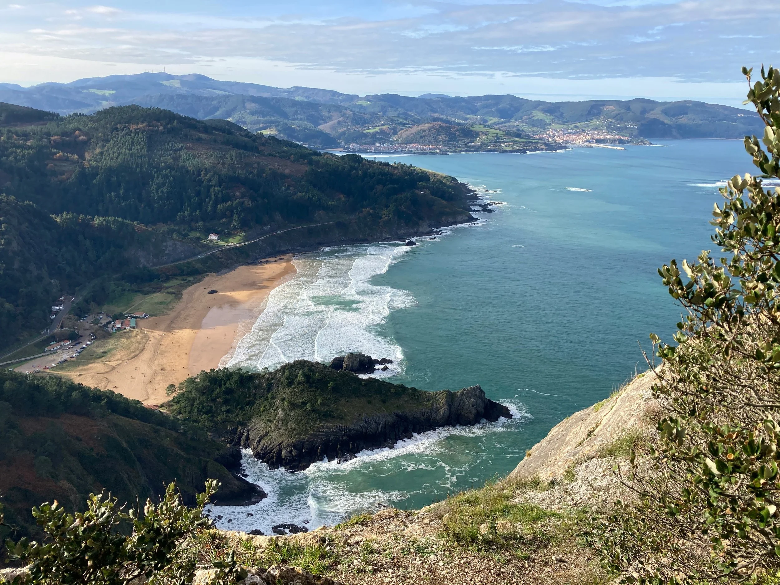 Coastal cliffs and beach in the Basque Country, Spain — a changing picture of where retirees seek sun.