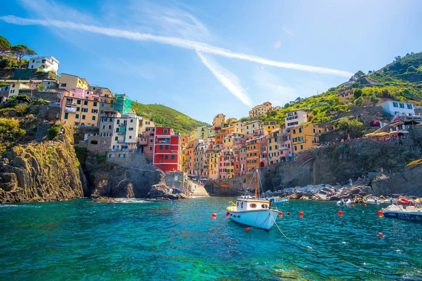 Colourful cliffside village of Riomaggiore in Cinque Terre, Italy, illustrating geoarbitrage for early retirement.