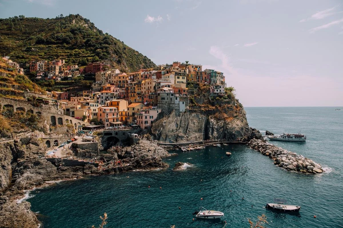 Manarola village in Cinque Terre, Italy — a Blue Zone-adjacent environment combining longevity lifestyle with FIRE retirement appeal.