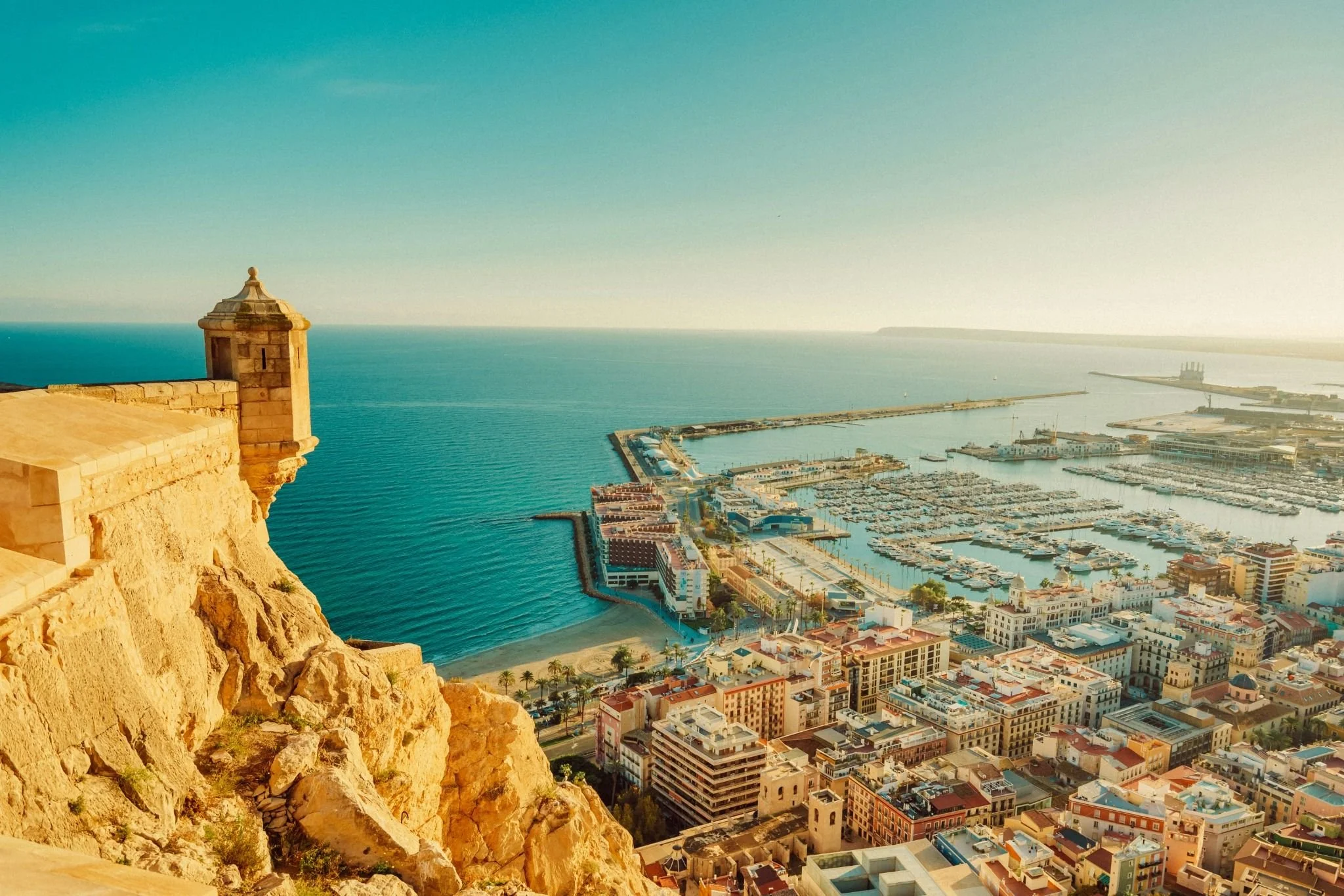Alicante Spain aerial view of harbor and city, a popular expat retirement destination projected to face rising hot summer days.