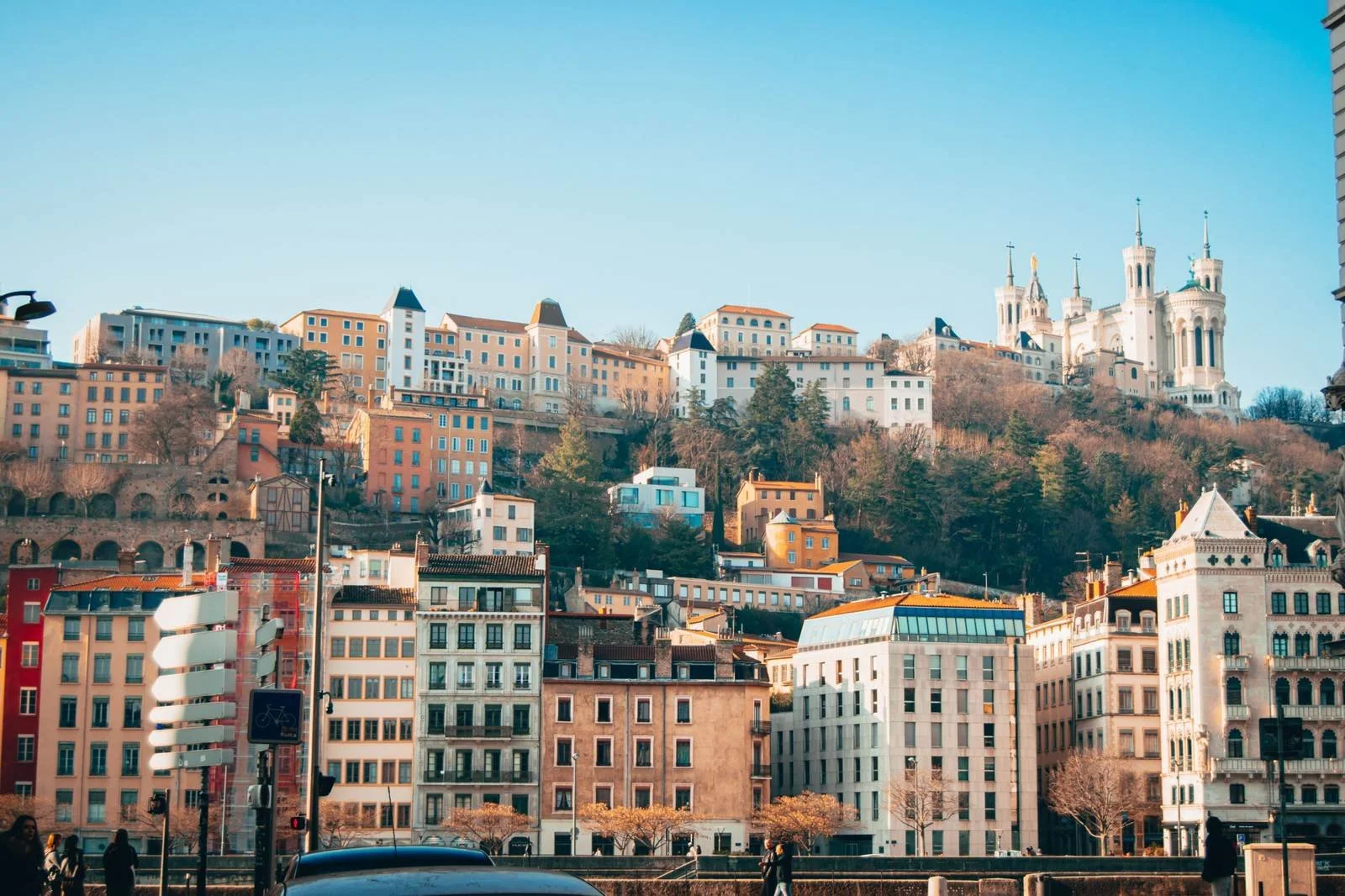 Hillside buildings and the Fourvière basilica rising above the old town of Lyon, France.